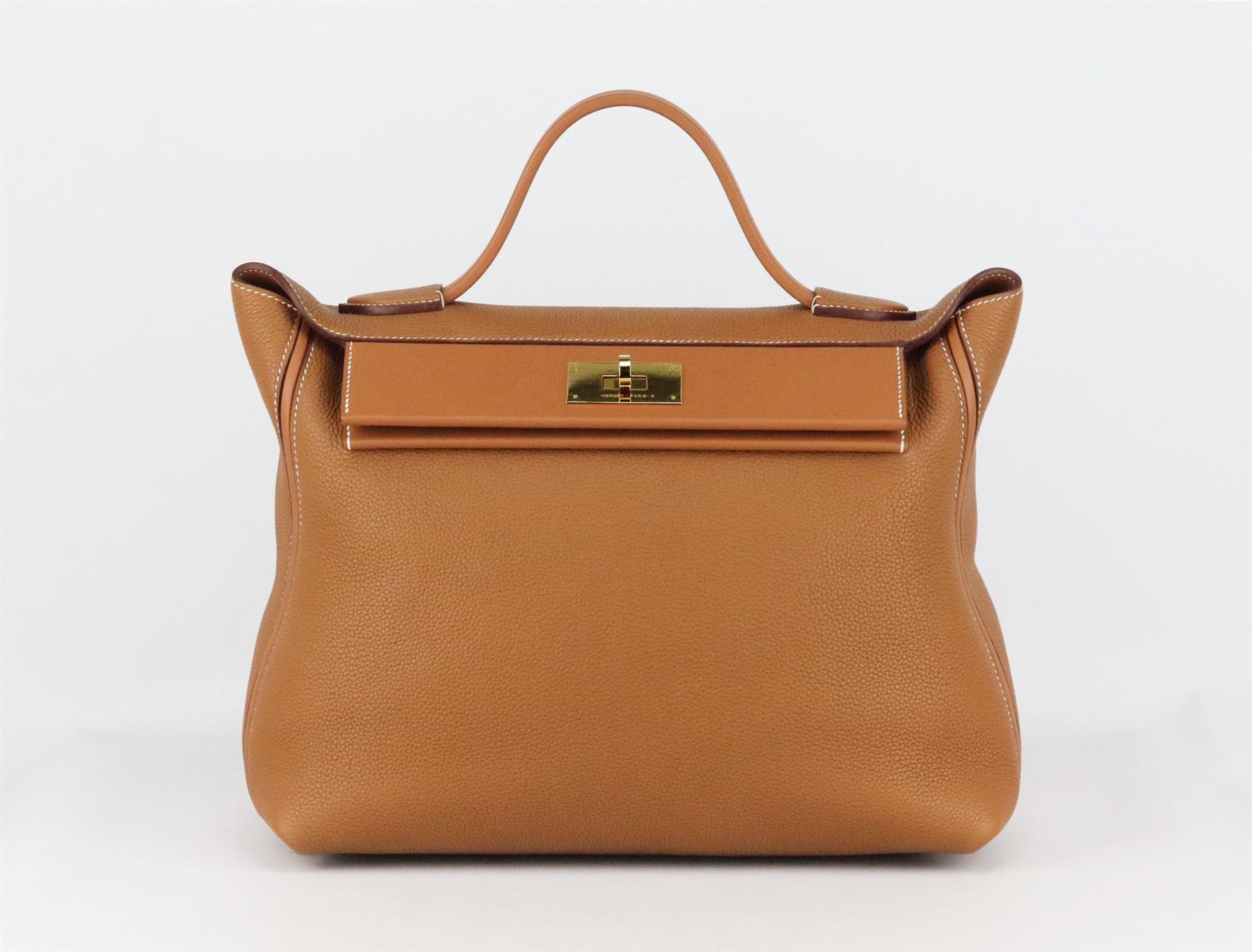 <ul>
<li>Made in France, this beautiful 2019 Hermès ‘24/24’ 35cm handbag has been made from soft tan Taurillon Maurice and Swift leather exterior and Swift leather interior, this piece is decorated with gold hardware on the front and finished with