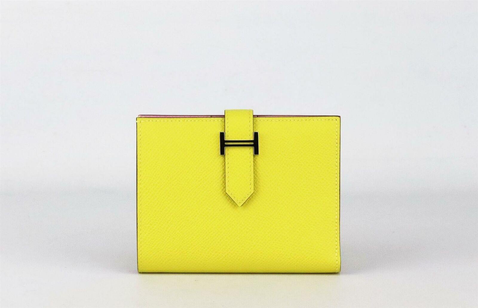 Made in France, this beautiful 2019 Hermès ‘Bearn Compact’ wallet has been made from textured Epsom leather exterior in ‘Lime’ and Epsom leather interior in ‘Mauve Silvestre’, it is decorated with palladium H hardware on the front and finished 4