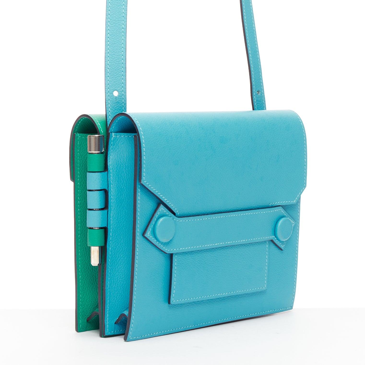 HERMES 2019 Twins green blue asymmetric snap flap reversible crossbody bag
Reference: KYCG/A00038
Brand: Hermes
Model: Twins
Collection: SS 2019
Material: Leather
Color: Blue, Green
Pattern: Solid
Closure: Flap
Lining: Blue Leather
Extra Details: