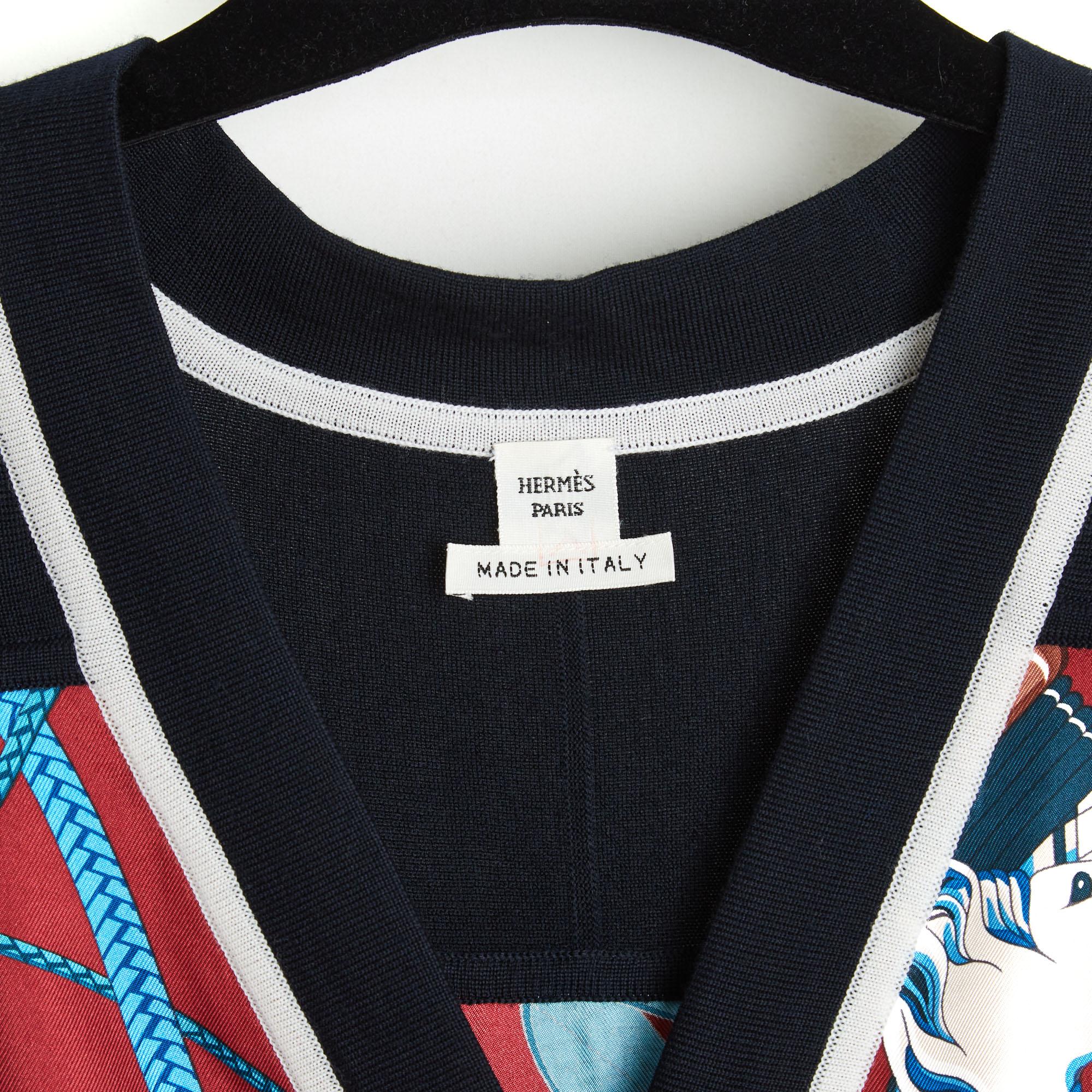 Hermès dress year 2021 Twillaine series Fouets et Badins pattern by Virginie Jamin (edited in square in 2017), straight cut, in black wool knit edged with ecru along the deep V neckline in front, pattern applied over the entire height at the front