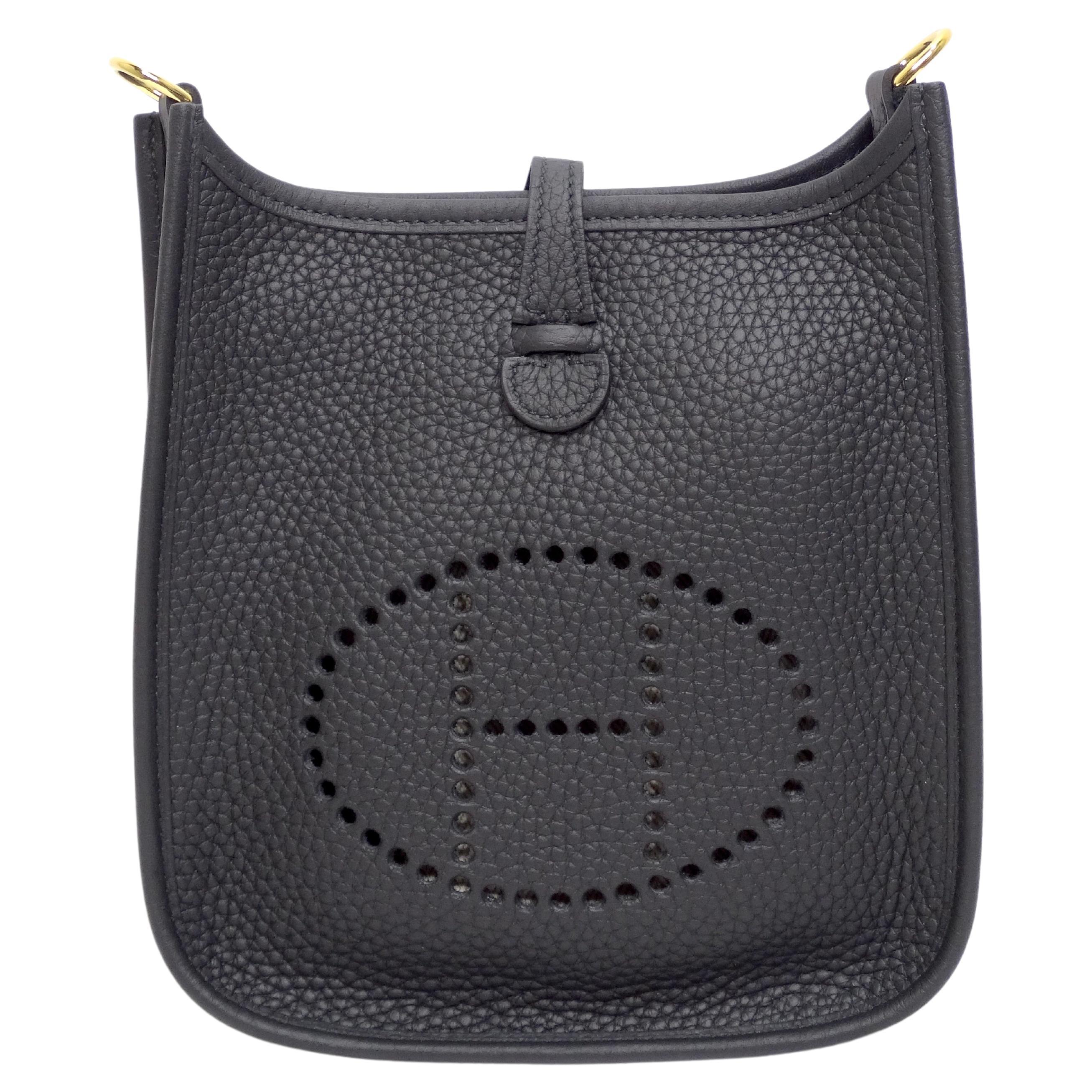 Your everyday bag has arrived! This is the adorable Hermès Evelyne TPM (Très Petit Modèle), also known as the Hermès Mini Evelyne or Evelyne 16 and is the smallest of the iconic Evelyne line. This chic and smart black shoulder bag measures