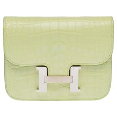 Hermès 2024 Constance Slim Yellow Alligator Clutch with Silver Trim
