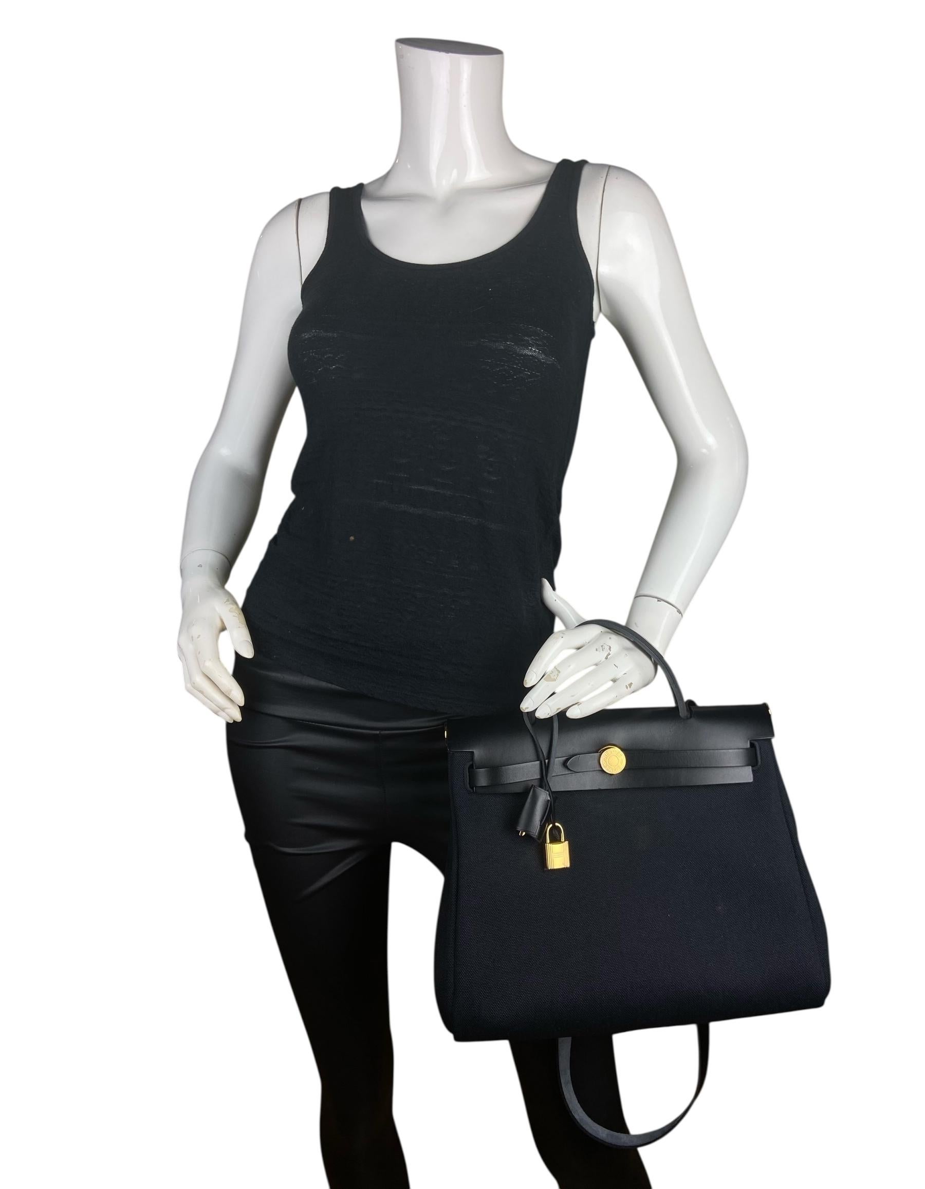 Hermes 2025 Black Toile Militaire Canvas and Leather Herbag Zip 31 Bag

Made In: France
Year of Production: 2025
Color: Noir black
Hardware: Goldtone
Materials: Canvas & leather
Lining: Canvas
Closure/Opening: Flap top with double strap
Exterior