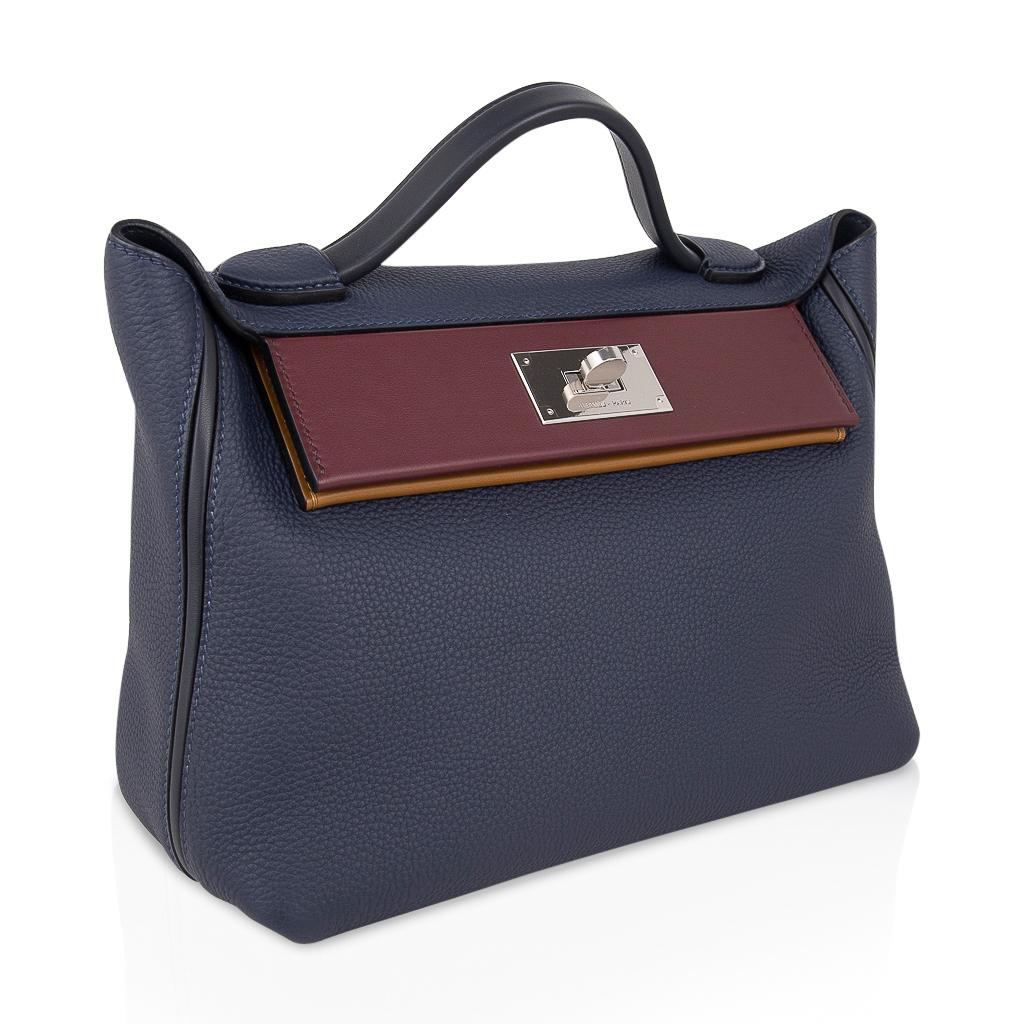 Mightychic offers an Hermes 24/24 29 bag featured in Blue Nuit, Indigo, Bordeaux and Kraft. 
Slouchy, chic as has style whether worn as a top handle, shoulder or crossbody bag. 
Accentuated with palladium hardware. 
Togo leather with Swift leather
