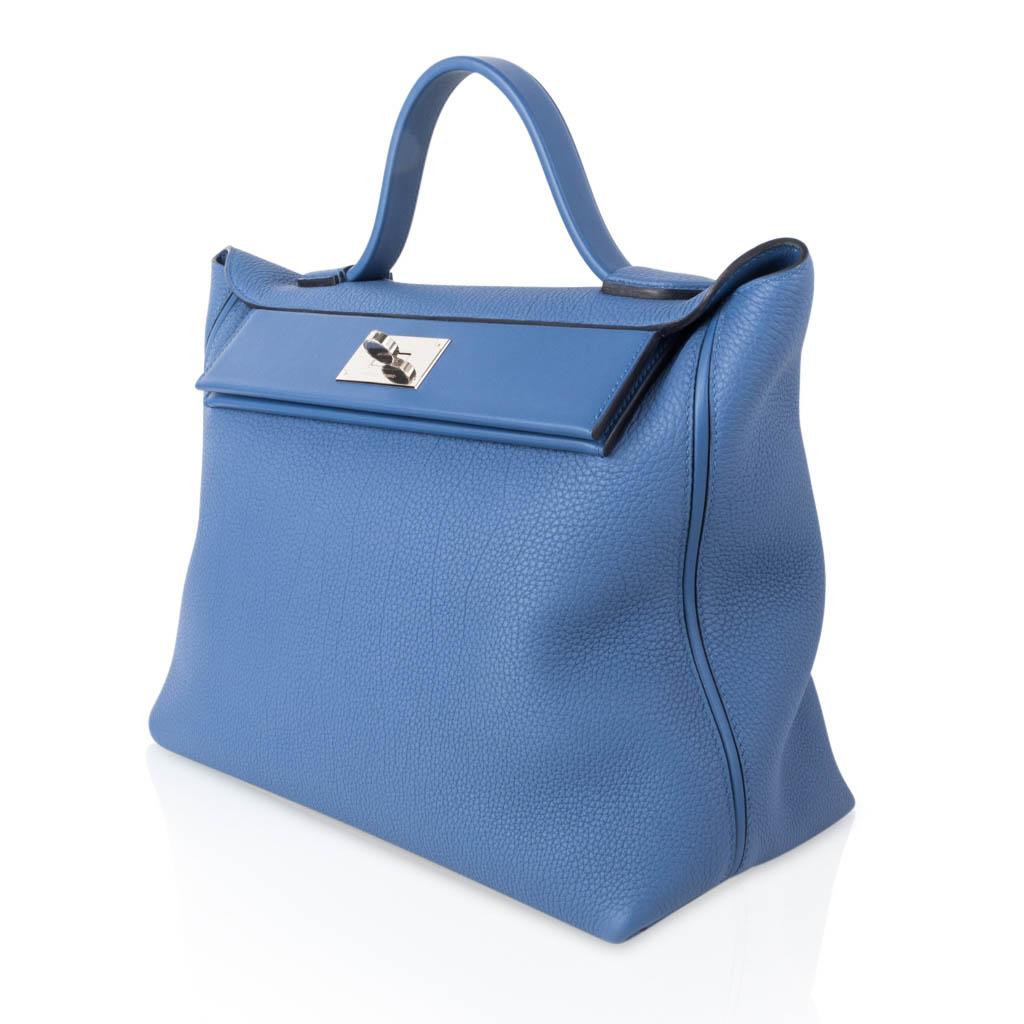 Guaranteed authentic Hermes 24/24 35 bag features Blue Brighton and palladium hardware.
The 35 cm is the most rare size to find in the 24/24. 
Togo leather with Swift leather accent panel.
Comes with signature Hermes box and sleepers. 
NEW or NEVER