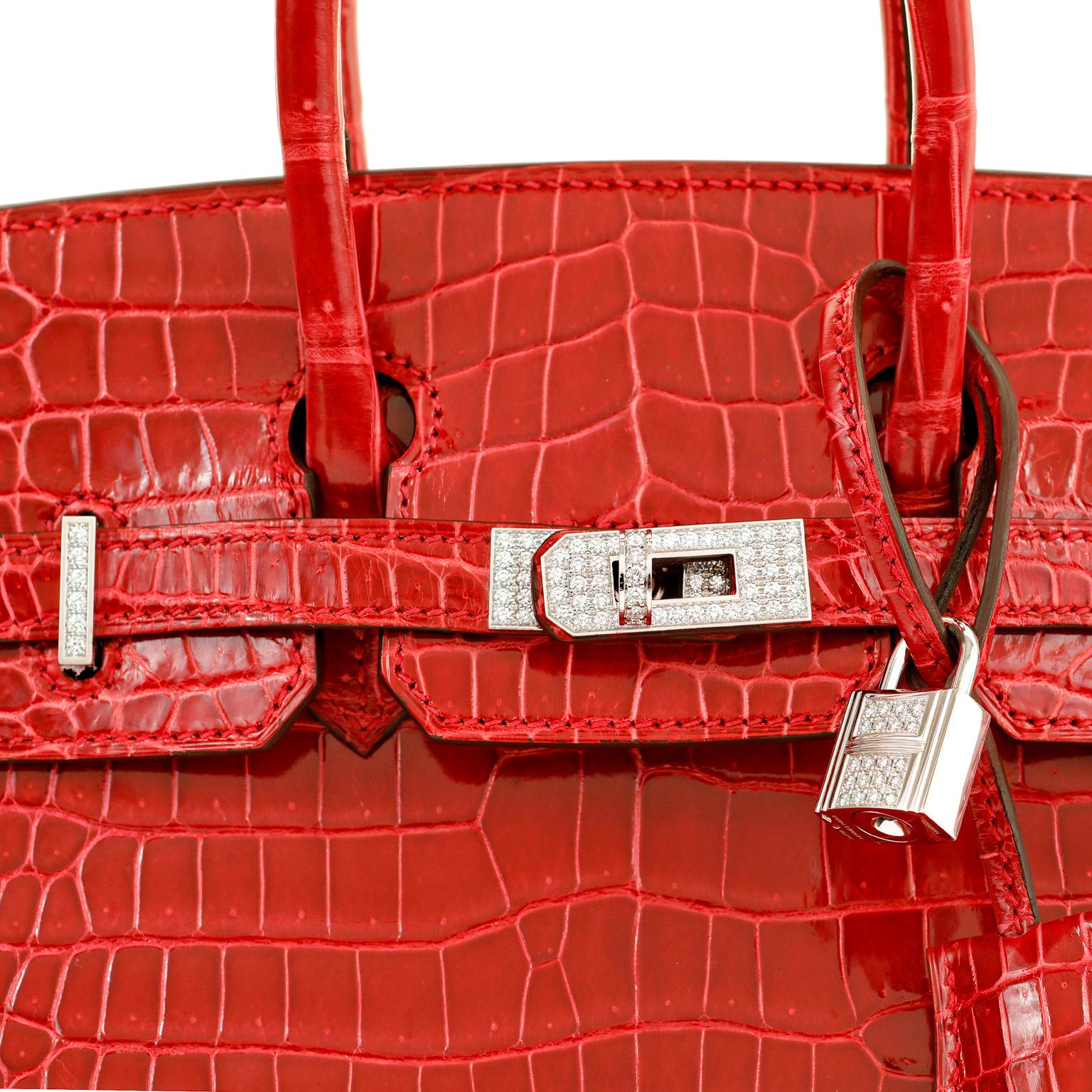 This authentic Hermès 25 cm Lipstick Red Porosus Crocodile Diamond Encrusted Birkin is in pristine unworn condition, never before carried.  Incredibly rare and specially ordered, this exotic Birkin is perhaps the most collectible of all. 

Porosus