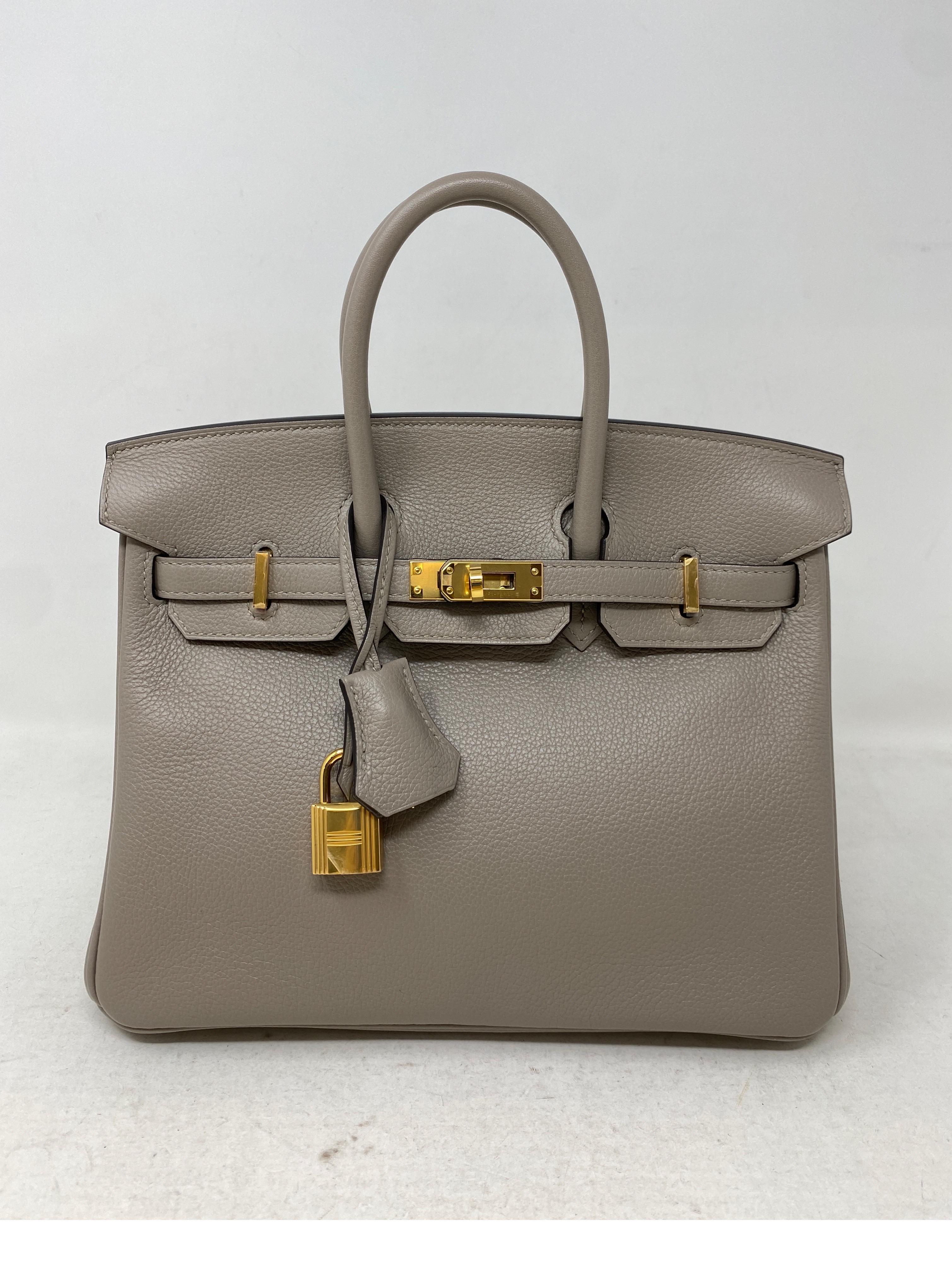 Hermes Gris Asphalte Birkin 25 Bag. Gorgeous light grey color. Gold hardware. Rare color and size. Unicorn 25 bag. Beautiful bag in excellent condition. Newer bag. Includes clochette, lock, keys, and dust bag. Guaranteed authentic. 