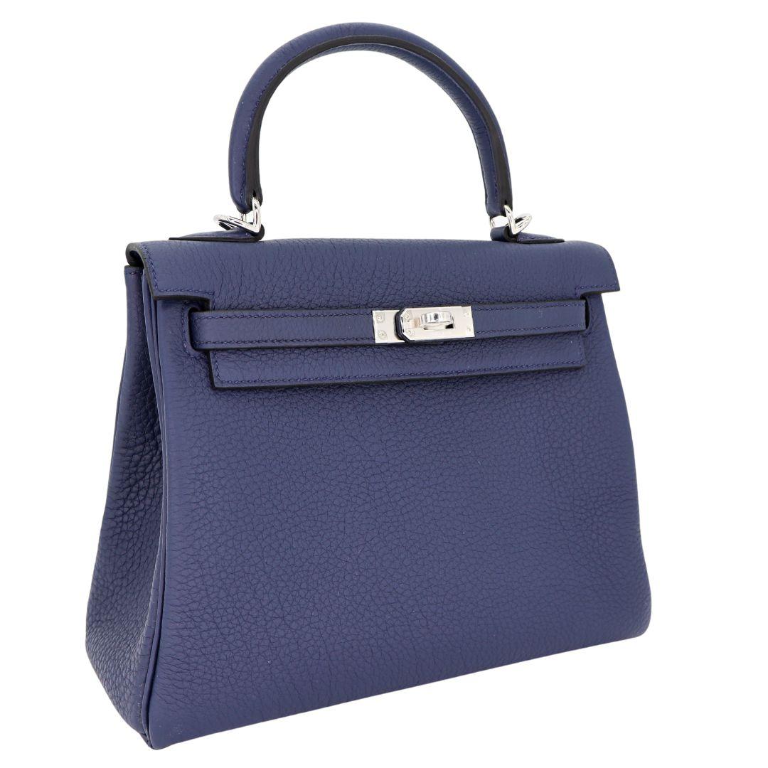 Brand: Hermès
Style: Kelly Retourne
Size: 25cm
Color: Bleu Navy
Material: Togo Leather
Hardware: Palladium Hardware (PHW)
Dimensions: 9.8