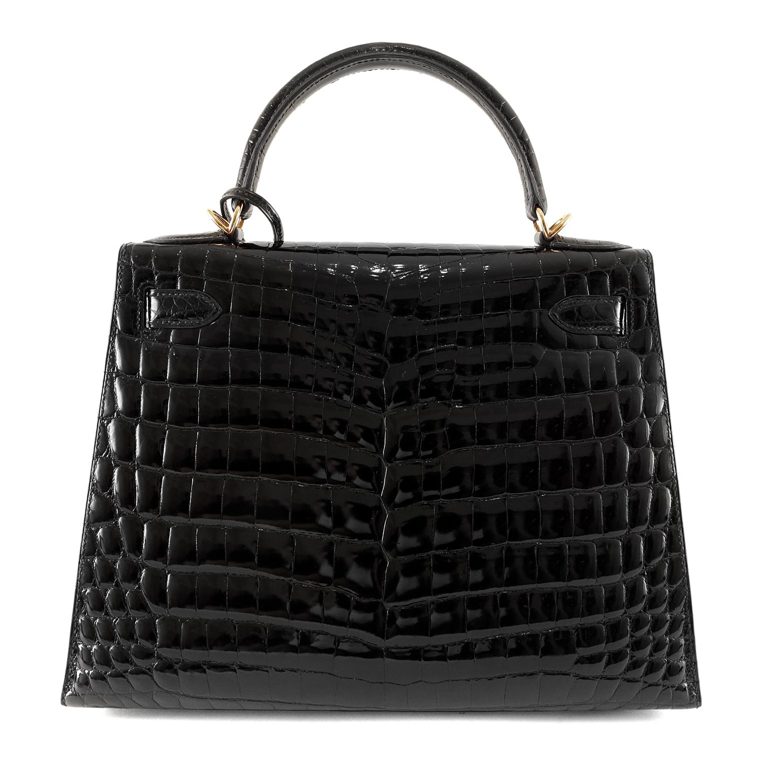 Hermès 28 cm Black Crocodile Kelly- Never Carried, as new condition
  Hermès bags are considered the ultimate luxury item the world over.  Hand stitched by skilled craftsmen, wait lists of a year or more are commonplace for the leather versions.  A