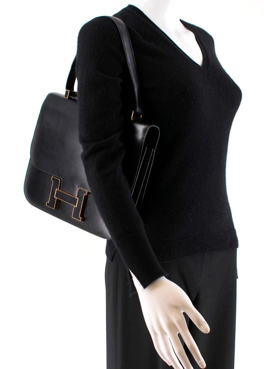 Hermes 29cm Cartable Constance Tote

- Age [R] 2014
- Black Constance H buckle with gold trim
- Gold hardware 
- Back pocket
- 2 inline pockets, one with a zipper
- Made in France
- Can be worn on the shoulder or as a top handle

Please note, these