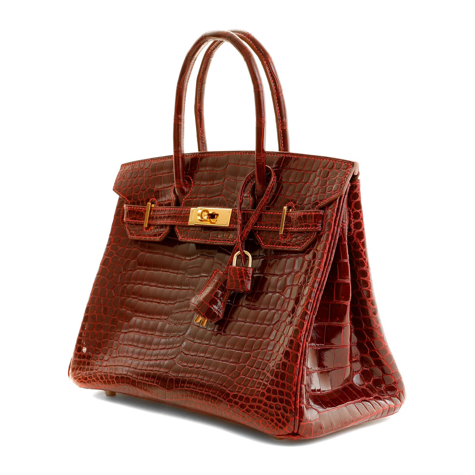 This authentic Hermès 30 cm Bordeaux Crocodile Birkin is in pristine condition and has been meticulously stored.   Hermès bags are considered the ultimate luxury item the world over.  Hand stitched by skilled craftsmen, wait lists of a year or more