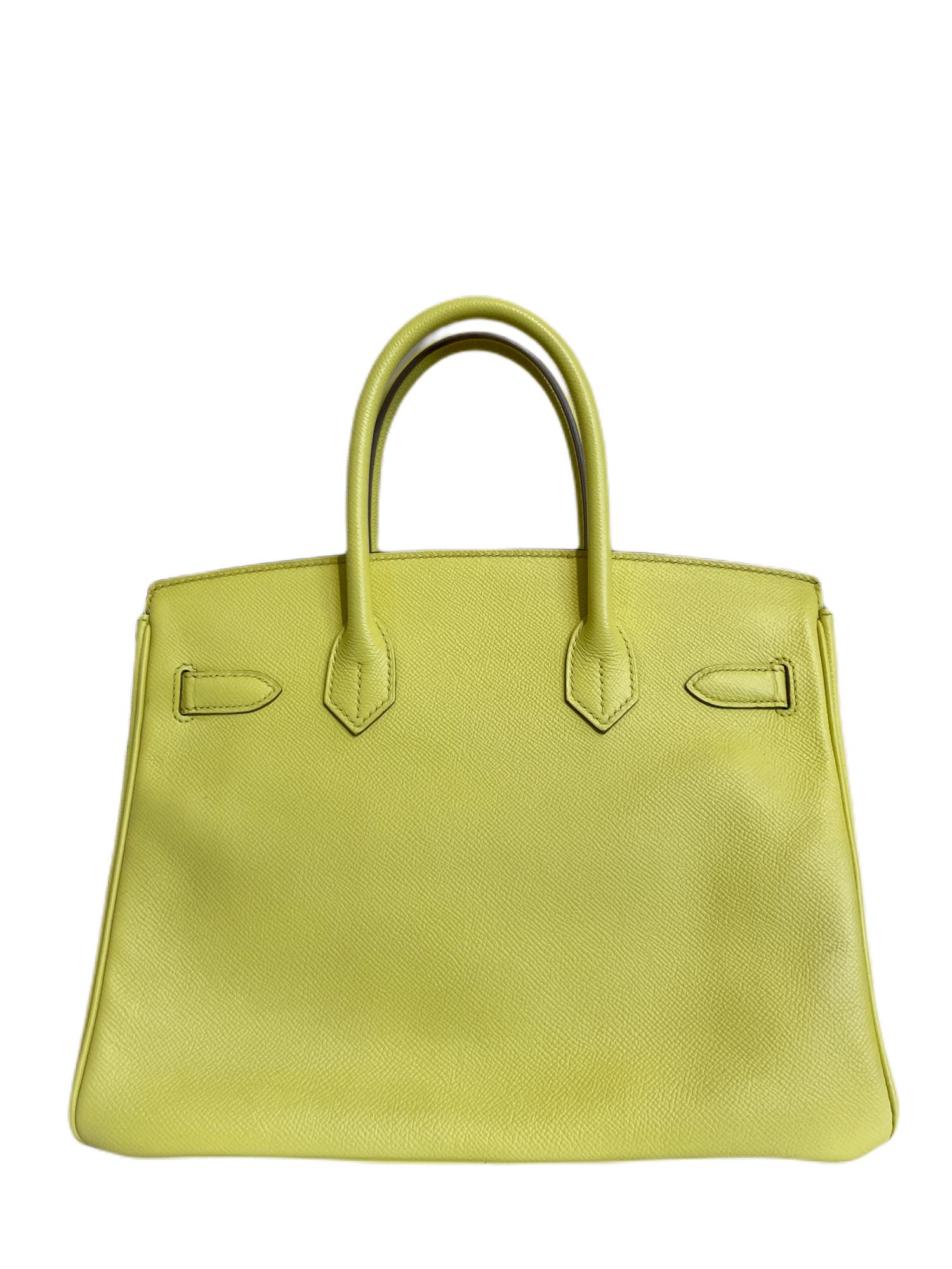 This authentic Hermès Shocking Green Epsom Birkin is pristine with the protective plastic intact on the Palladium hardware.  A vivid pop color, Soufre (chartreuse green) also surprisingly functions as a neutral.  
Textured Epsom leather is