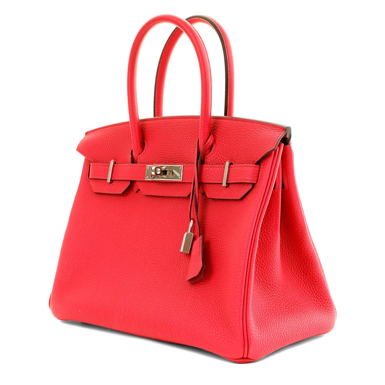 This authentic Hermès 30 cm Strawberry Togo Leather Birkin is in pristine unworn condition.  The protective plastic is on all the hardware and it is exquisite.
Togo is scratch resistant calf leather; it is textured with a wonderful grainy