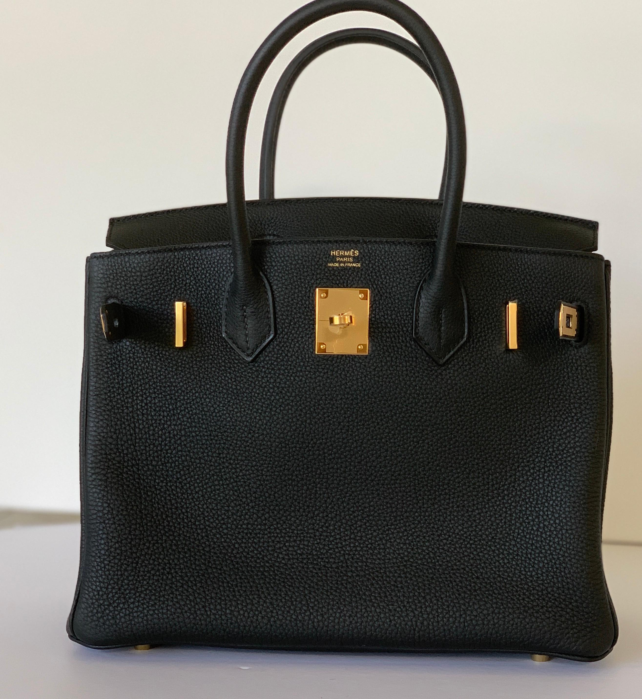 Hermes
Black Birkin 30cm
Togo Leather
Gold Hardware
Collection D
Every collector has a black with gold in their collection!
Just arrived from Hermes Boutique
Plastic on all the hardware

 
*Breloque charms not included

The interior is lined with