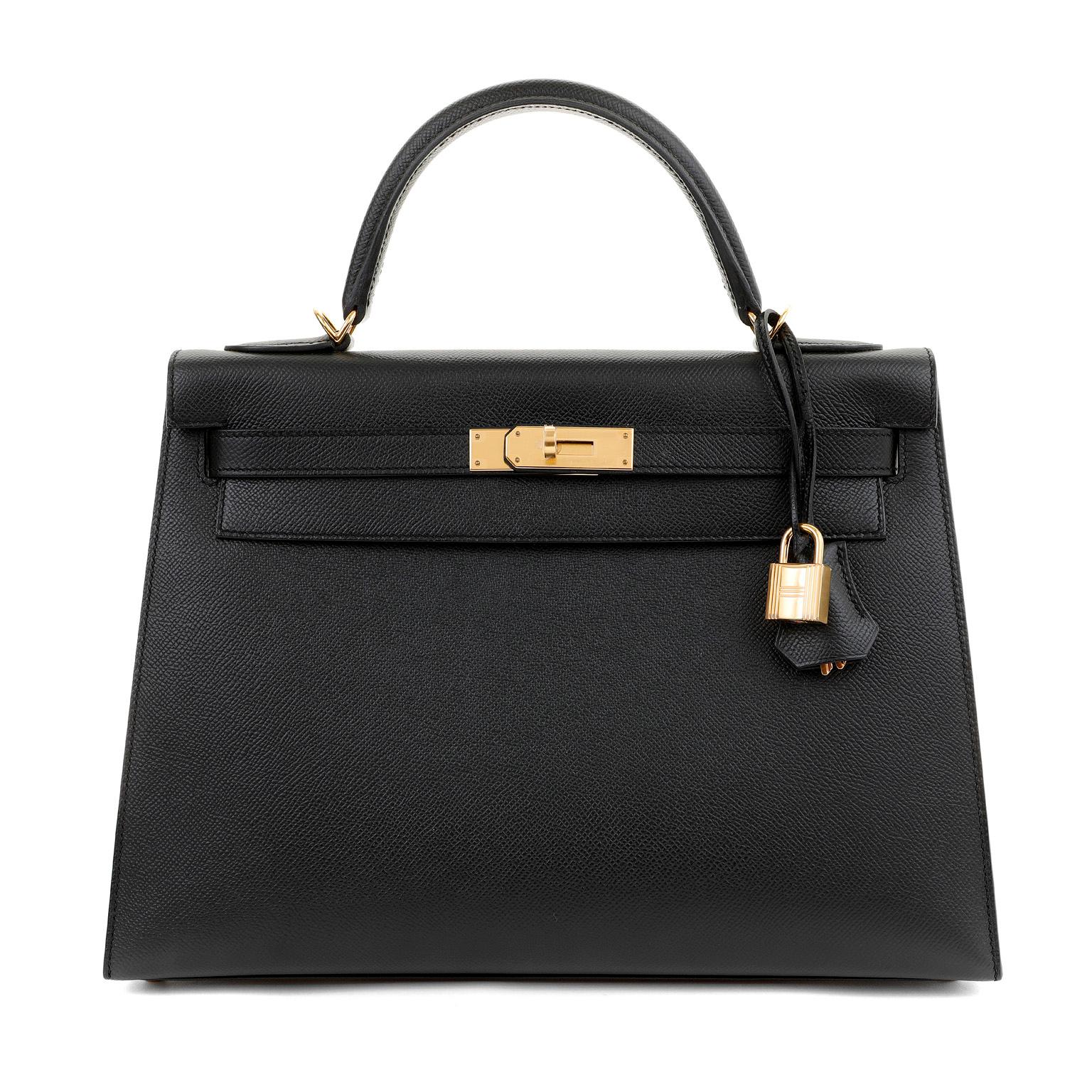 This authentic Hermès 32 cm Black Epsom Kelly Sellier is in pristine unworn condition with the protective plastic intact on the hardware.  Hermès bags are considered the ultimate luxury item worldwide.  Each piece is handcrafted with waitlists that