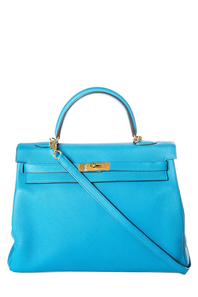 Hermes Clemence Izmir Kelly 35cm with gold-plated hardware, single rolled top handle, detachable flat shoulder strap, protective feet at base, tonal leather interior, three interior pockets; one with zip closure and turn-lock closure at front flap.
