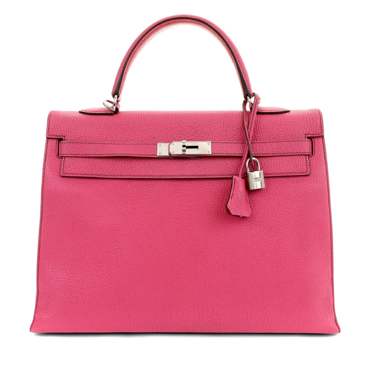 This authentic Hermès 35 cm Shocking Pink Chevre Kelly is in excellent plus condition. Coveted worldwide, the demure and classic Kelly bag is highly desirable in this eye-catching pop of pink. 

Intense pink chevre leather is extremely durable and