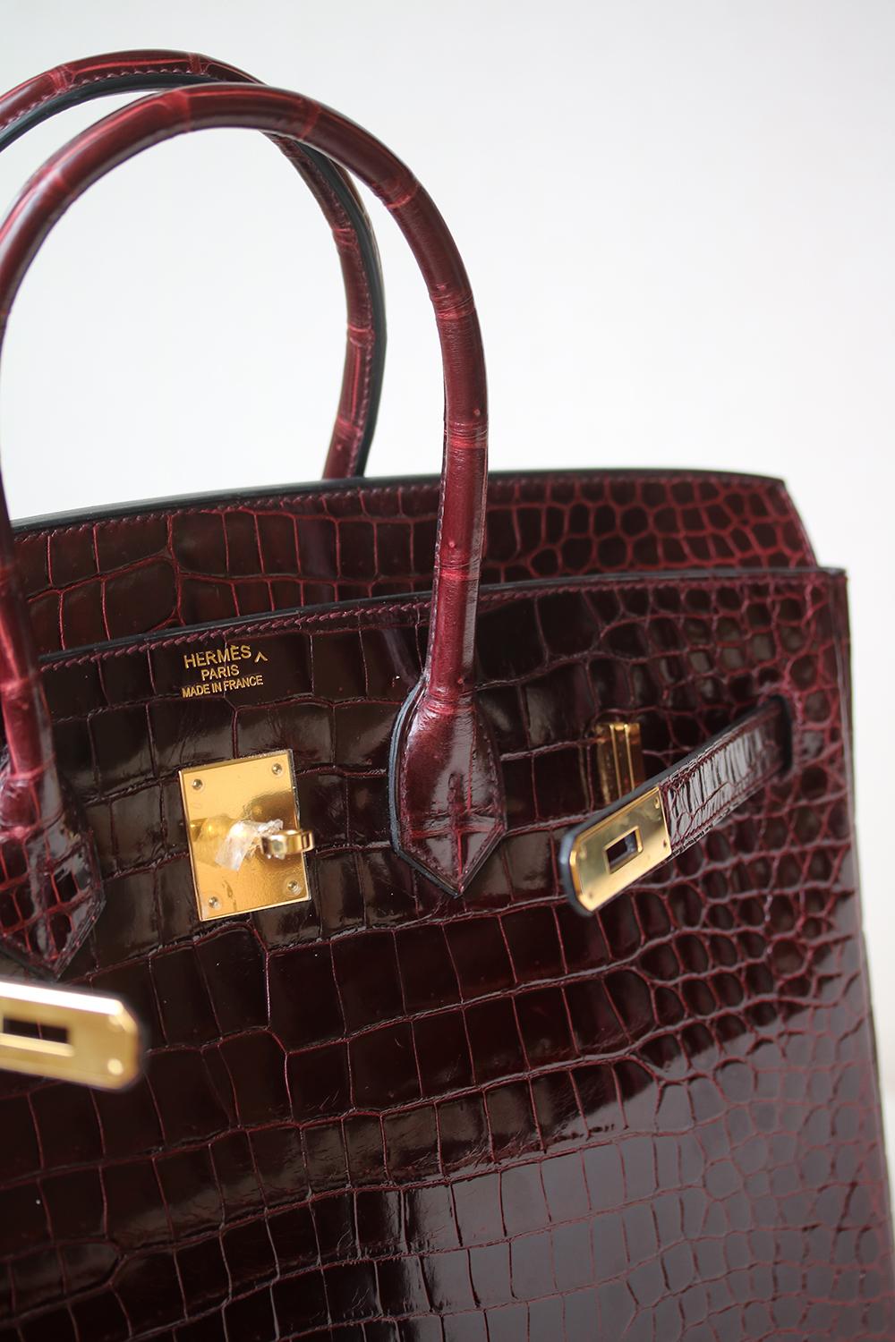 Hermès Burgundy Smooth Porosus Crocodile 35 cm Birkin Bag with Gold Hardware. The most fabulous of all bags can be yours today! Luxuriously rich coloured with tonal top stitching. This Birkin is in excellent condition. Only lightly used. Has been
