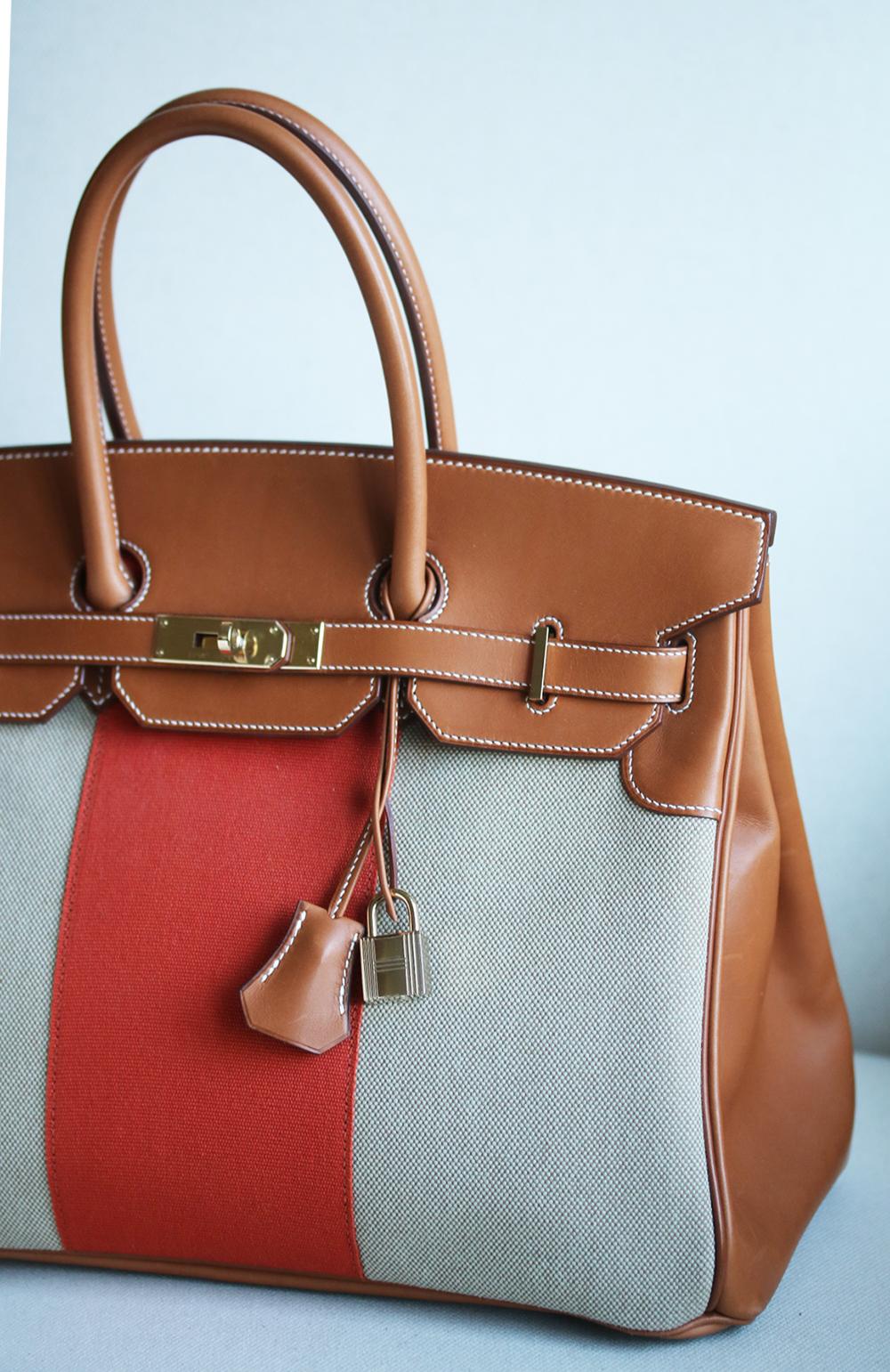 This extremely beautiful Limited Edition Hermès 35cm Flag Barenia Toile Birkin Bag with Permabrass Hardware is a must have for your collection! The beautiful rich tan leather exterior with orange and neutral toiles well with many pallettes. The bag