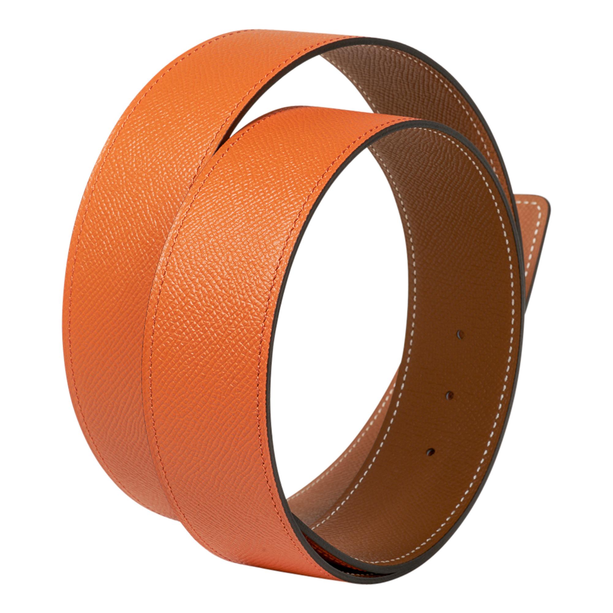 Guaranteed authentic Hermes Constance 42 mm belt features reversible Orange to Golde.  
Fabulous over sized brushed gold signature H buckle.  
The 42 mm now a retired size, this is sure to become a collectors treasure. 
Epsom leather.
Signature