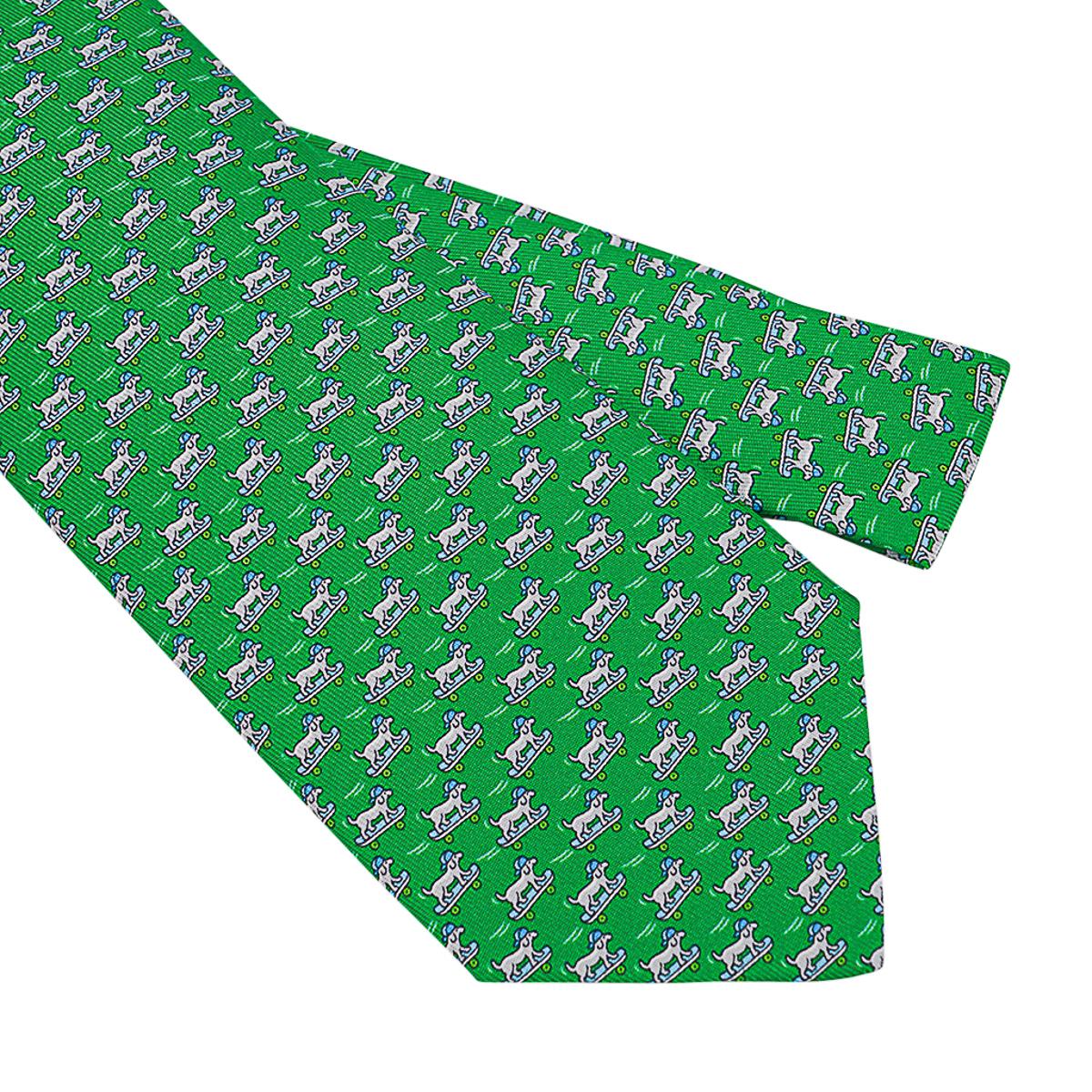 Mightychic offers an Hermes 7 Roller Dog Twillbi silk tie featured in Vert and Gris colorway.
Skateboarding dog with a helmet in the front.
The tail has a sitting dog and skateboards along the length.
Designed by Philippe Mouquet.
This delightful