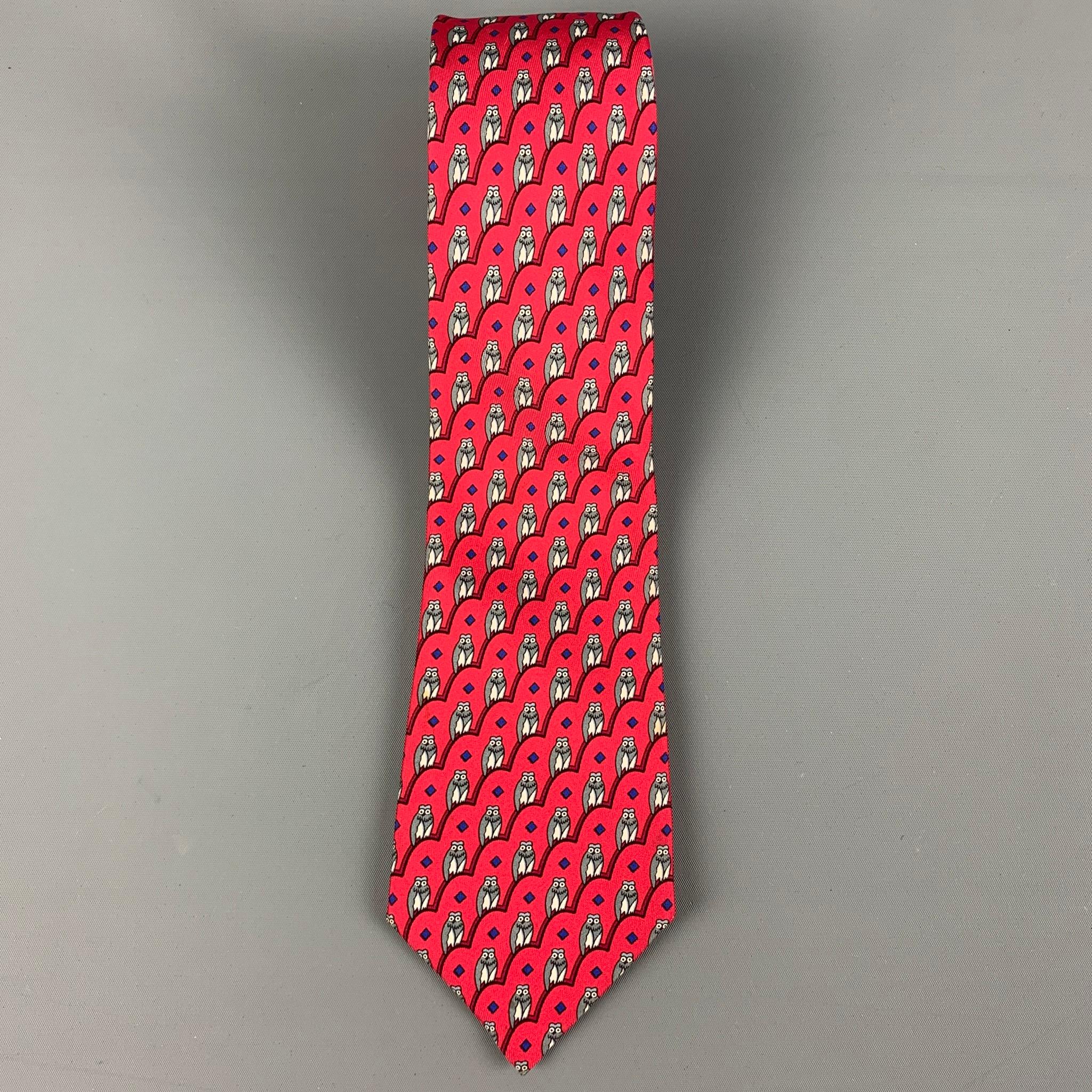 HERMES necktie comes in a red & grey silk with a all over owl print. Made in France.

Excellent Pre-Owned Condition.
Marked: 7167 FA

Measurements:

Width: 3.25 in. / 8.2 cm.
Length: 58 in. / 147.3
