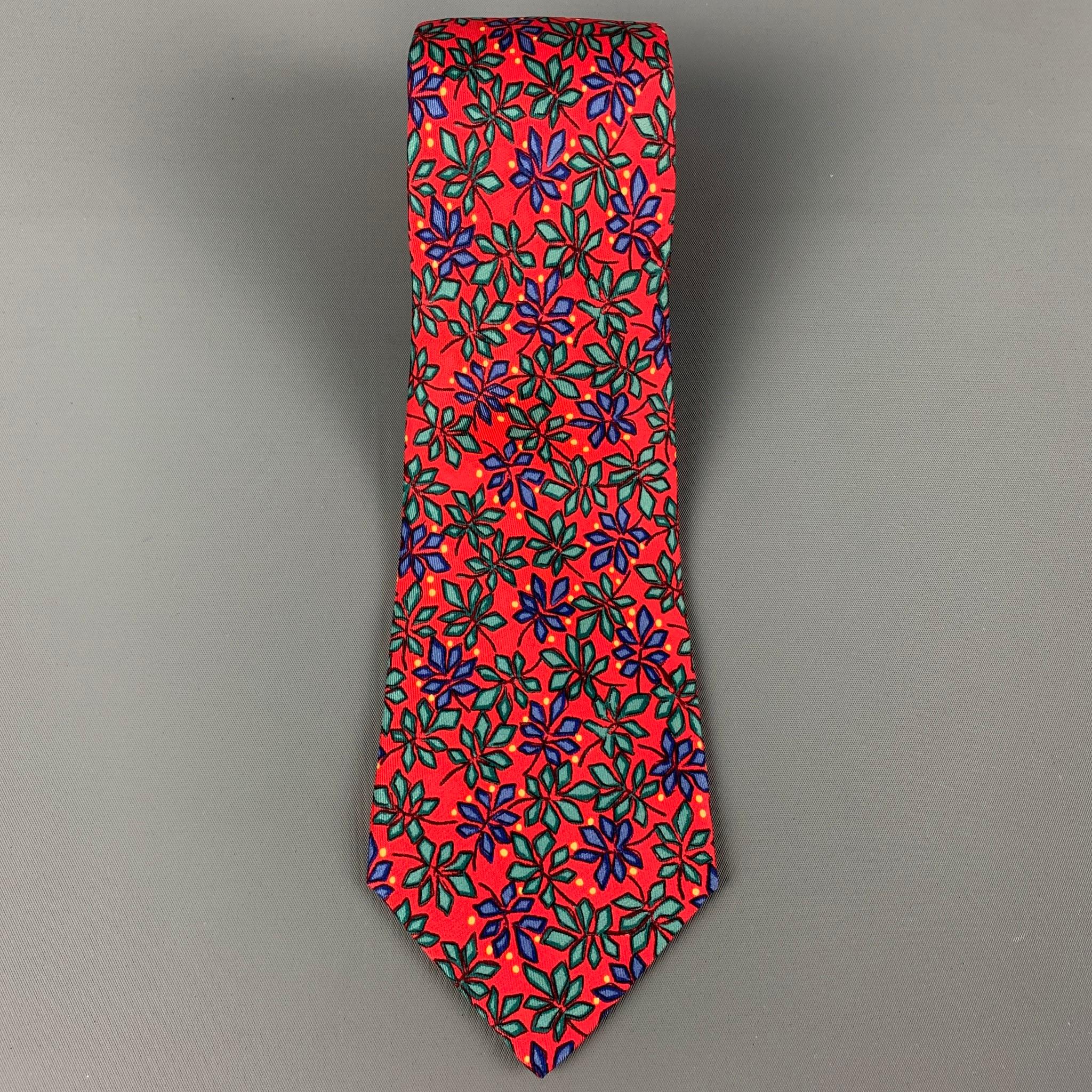 HERMES necktie comes in a red & multi-color silk with a all over poinsettias print. Made in France.

Excellent Pre-Owned Condition.
Maked: 7365 PA

Measurements:

Width: 3.5 in. / 8.8 cm.
Length: 59.5 in. / 151.1 cm.


