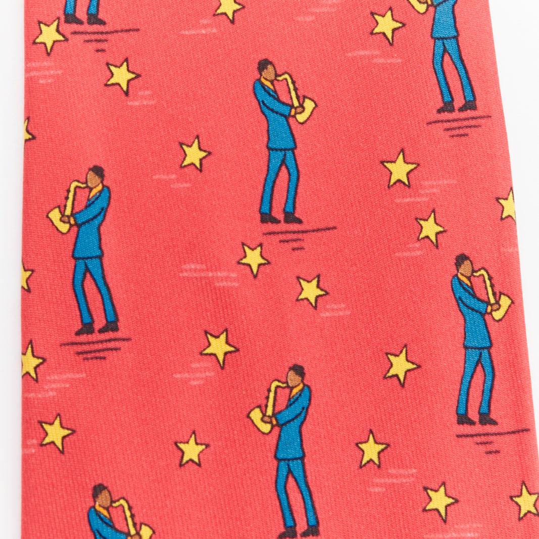Pink HERMES 7551 SA red yellow blue saxophone player star print silk tie For Sale