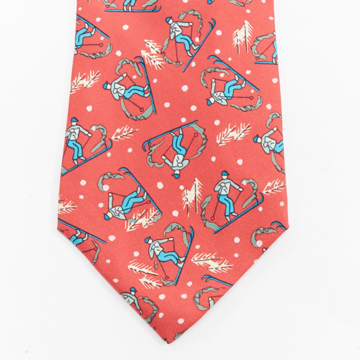 HERMES 7601 SA red blue blue skiier snow fall print silk tie
Reference: TGAS/E00704
Brand: Hermes
Model: 7601 SA
Material: Silk
Color: Red, Blue
Pattern: Cartoon
Lining: Red Silk
Extra Details: Christmas skiing print.
Made in: