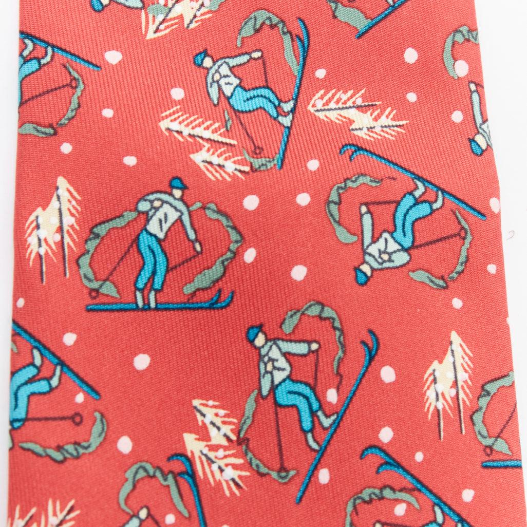 Pink HERMES 7601 SA red blue blue skiier snow fall print silk tie For Sale