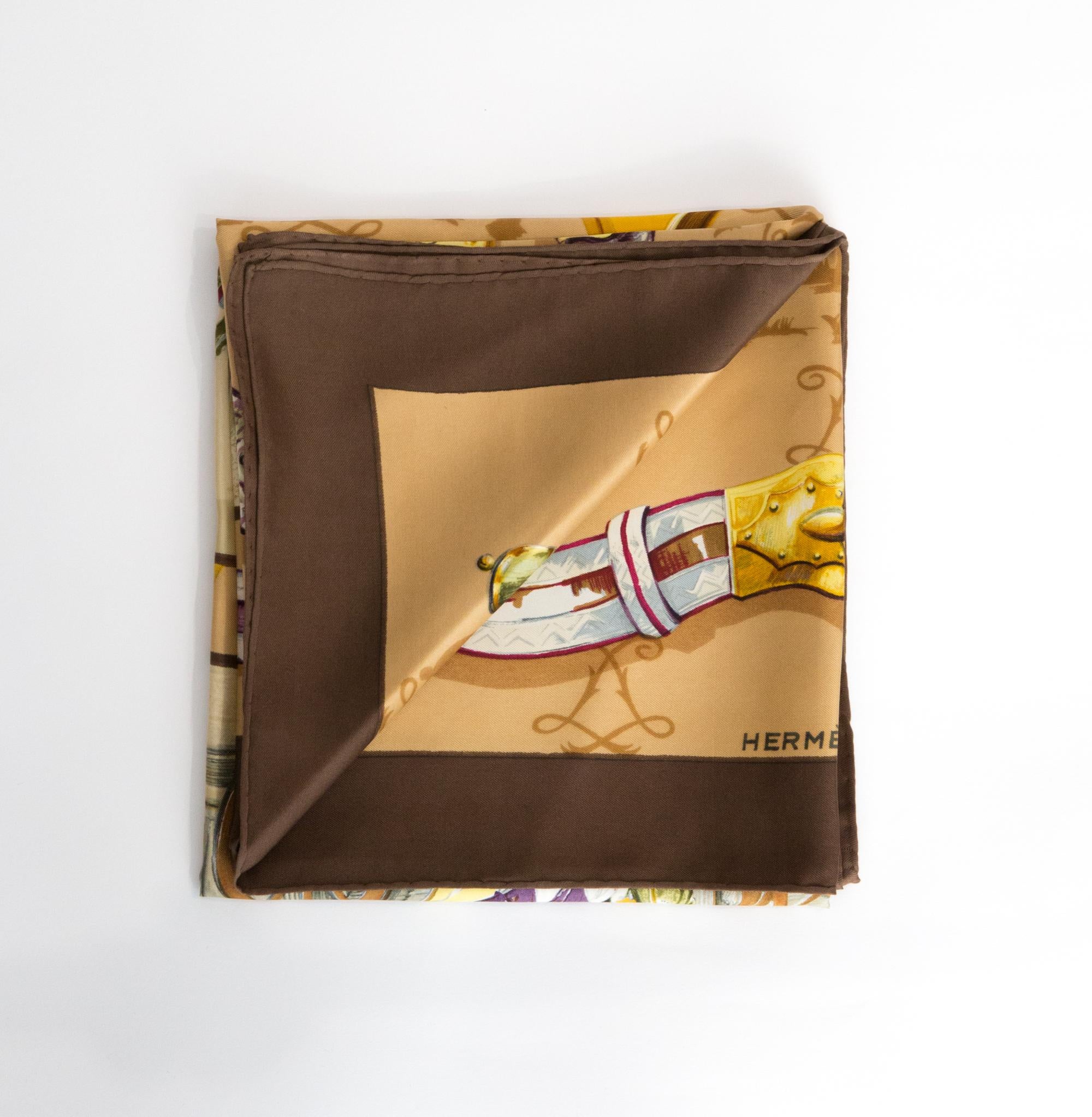 Hermes « A Cor et à Cri ...» by Charles J. Hallo silk scarf featuring a brown border and a Hermès signature. 
Circa 1960s
In good vintage condition. Made in France.
35,4in. (90cm)  X 35,4in. (90cm)
We guarantee you will receive this  iconic item as