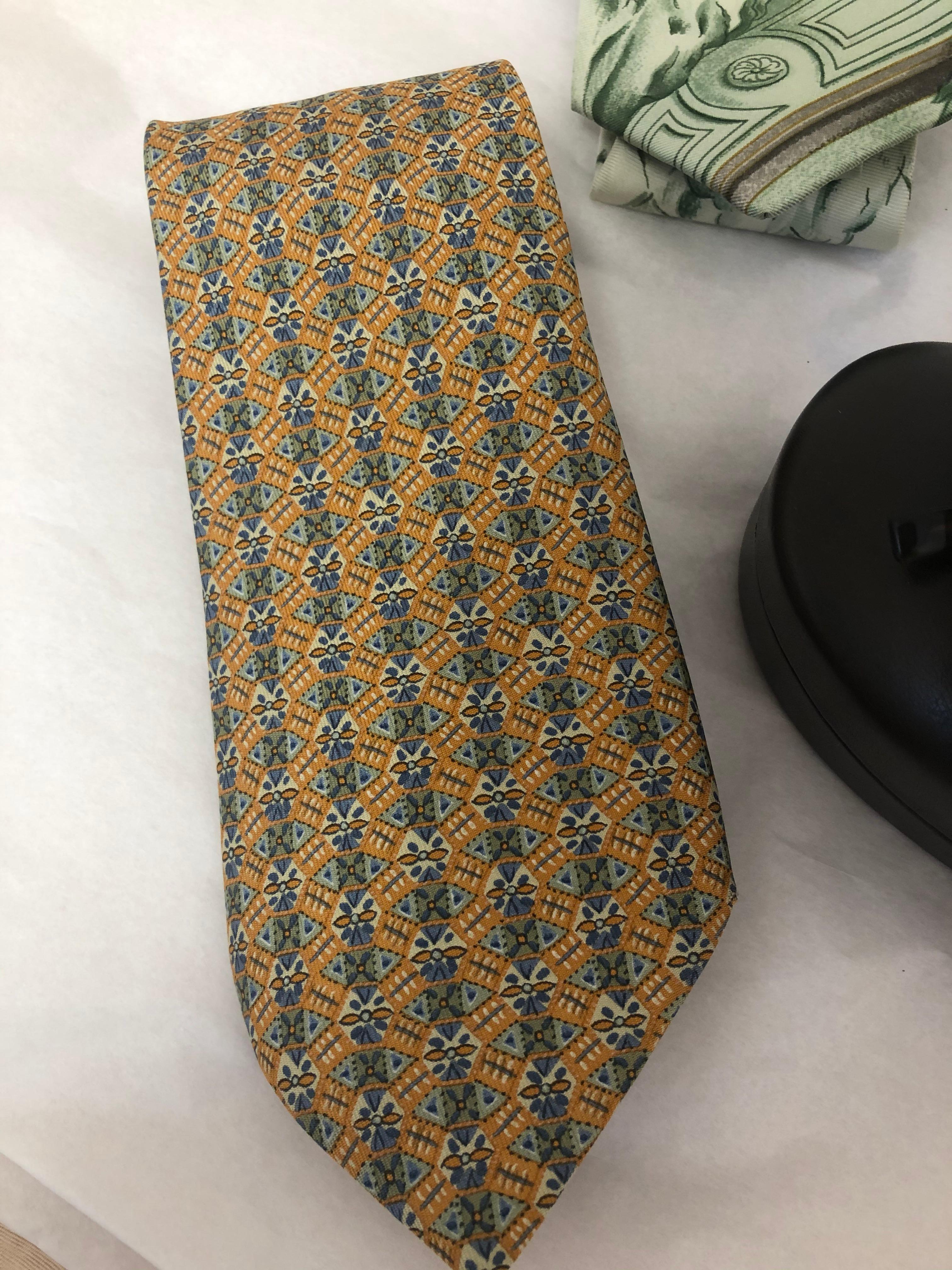 This trio of vintage ties fashioned of superior quality silk are from the 70s and 80s. They comprise of one with a rare 18th Century graphic (1992) by Catherine Baschet titled Azulejos du Pais de Queluz, which is a collector item, and two 1980s