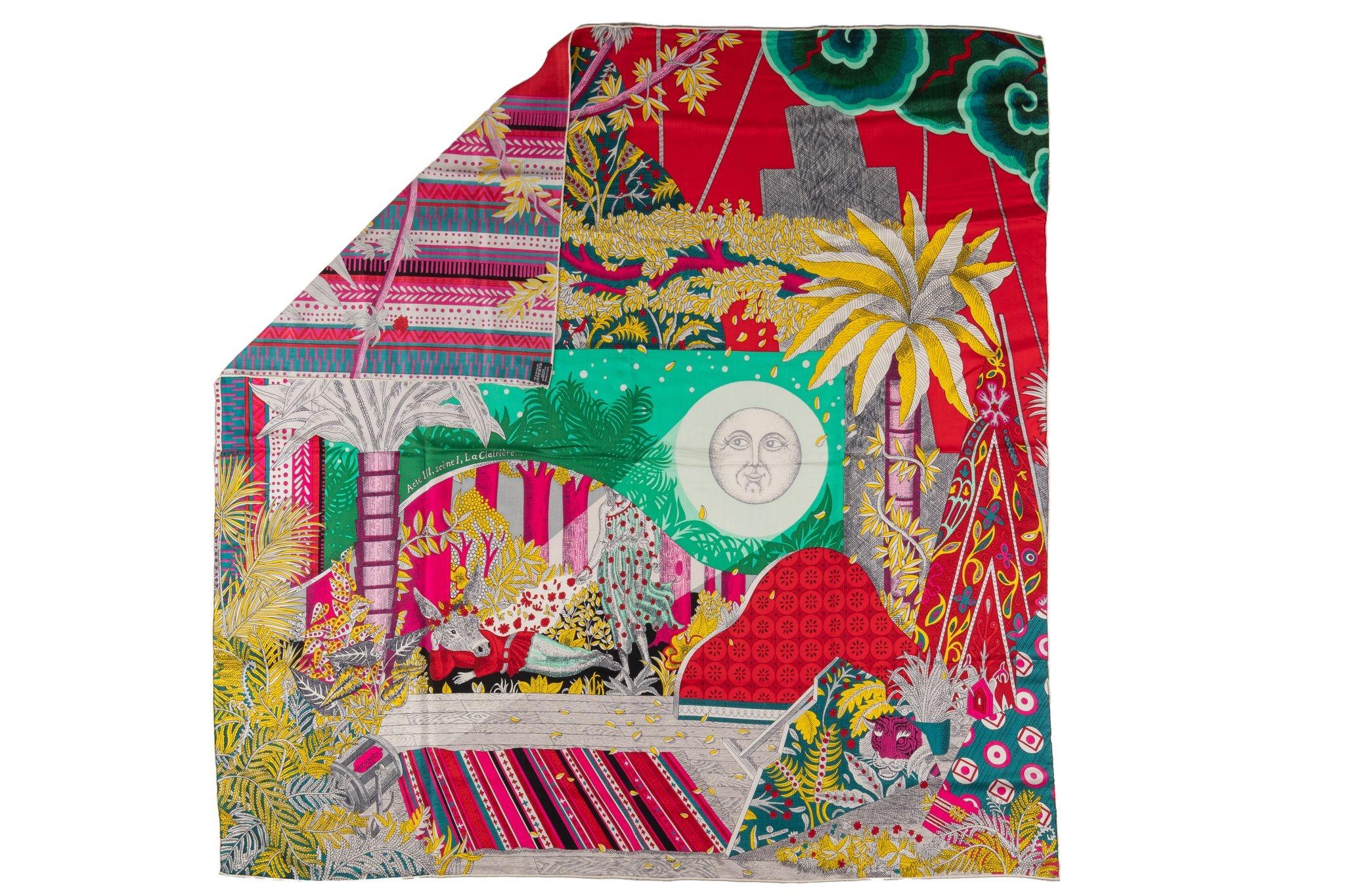 This is an Hermès Cashmere Silk Acte III Scene I La Clairiere Shawl in Rouge, Vert and Multicolor. The scarf is 70% cashmere and 30% silk and features a decorative multicolor design. The box is not included.