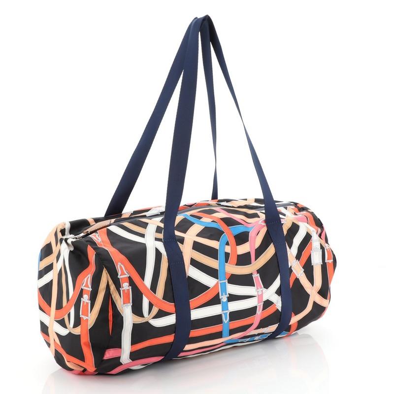 This Hermes Airsilk Duffle Bag Printed Silk 38, crafted from Multicolor Airsilk, features dual tall handles, and palladium hardware. Its zip closure opens to a Multicolor silk interior. Date stamp reads: A (2017). 

Estimated Retail Price: