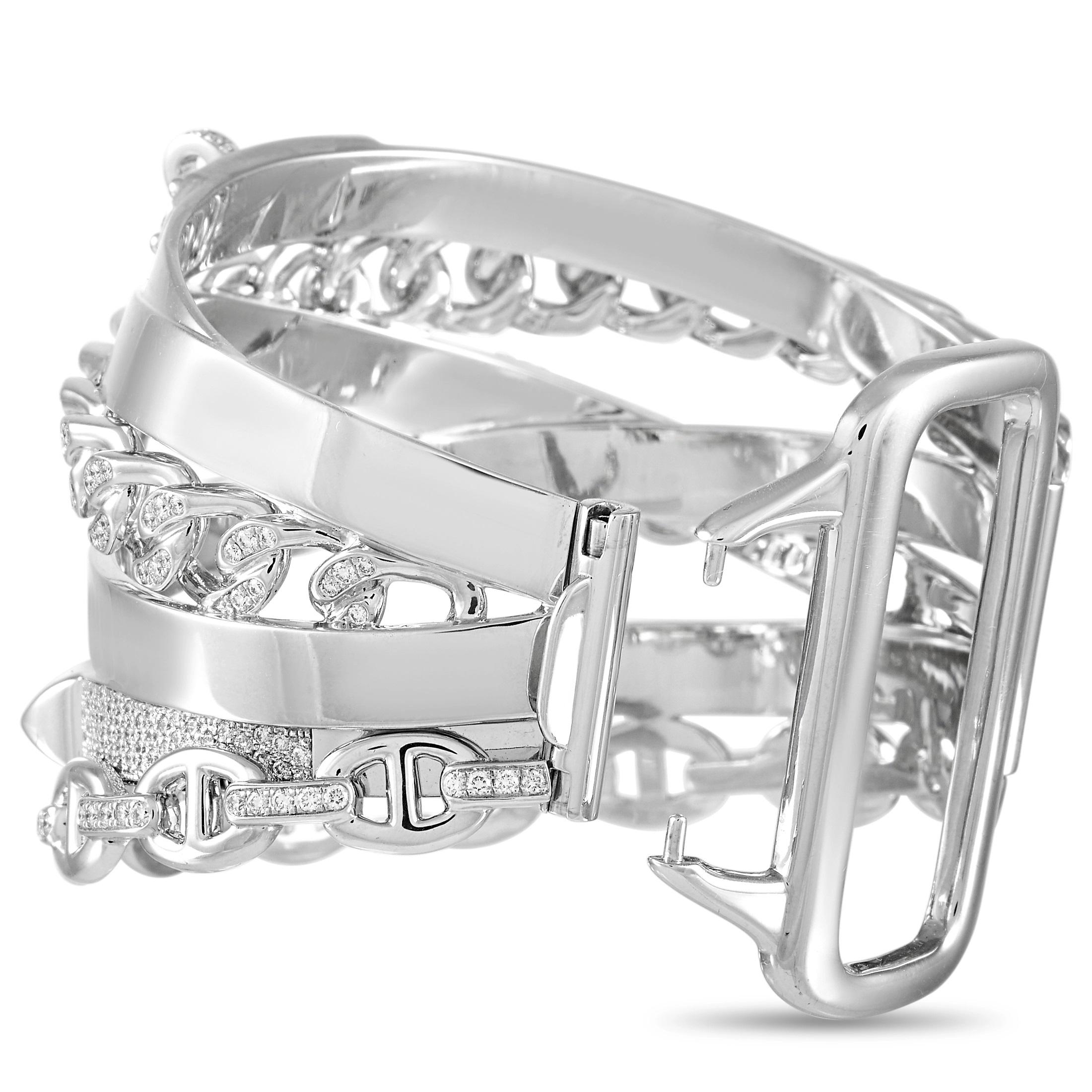 Creating a stylish stacked set is as easy as slipping on this singular Hermes Alchimie bracelet. Diamonds totaling 4.71 carats are elevated by the shimmering 18K White Gold setting. Bold and impossible to ignore, it measures 7.85” long. 
