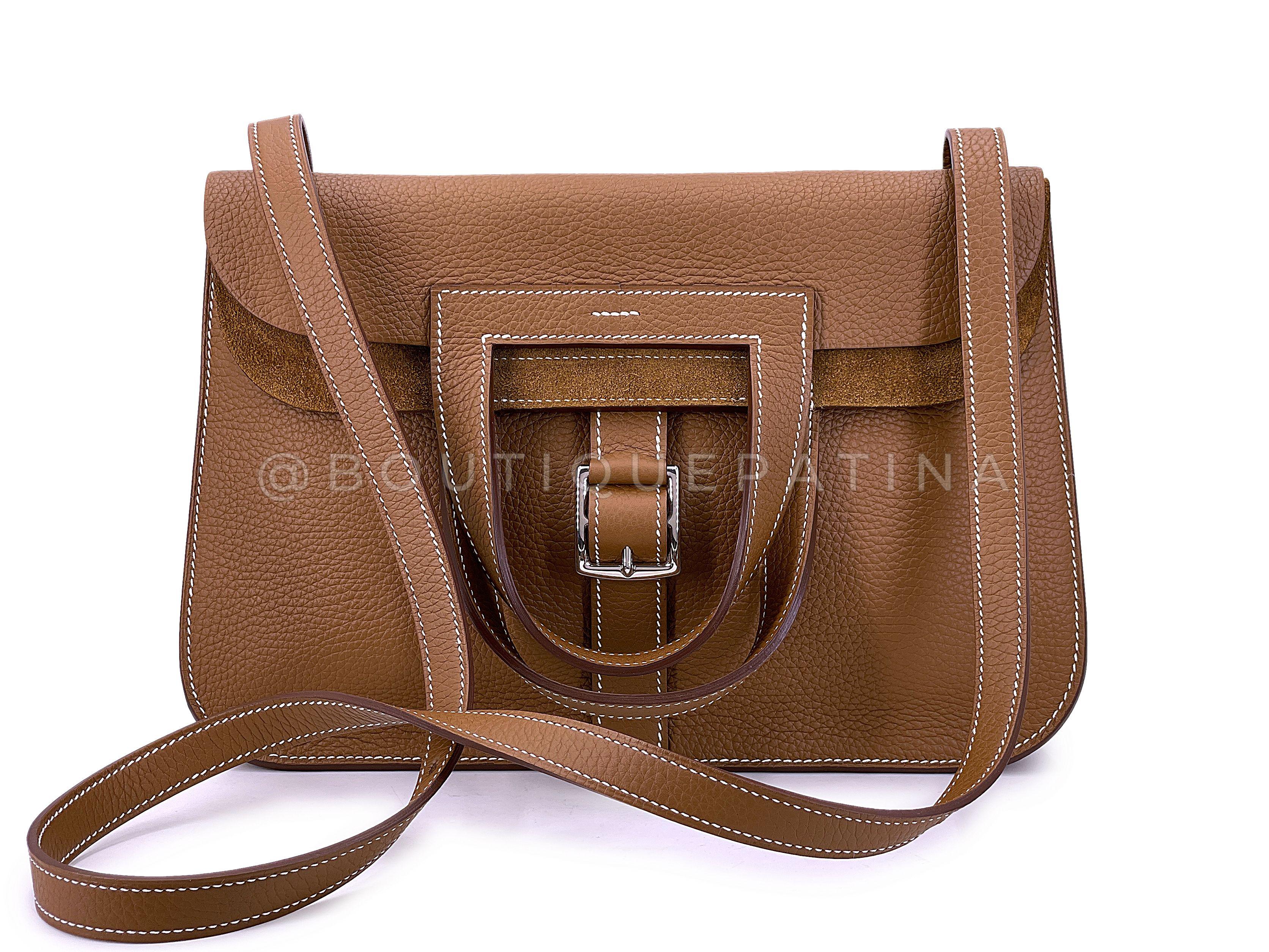 Store item: 67745
This Hermès Alezan H Halzan 4-way Buckled Shoulder Bag is extremely difficult to find in the boutiques.

Known and coveted for its versatility, the bag can be carried in four different ways: As a shoulder clutch, as a short handled