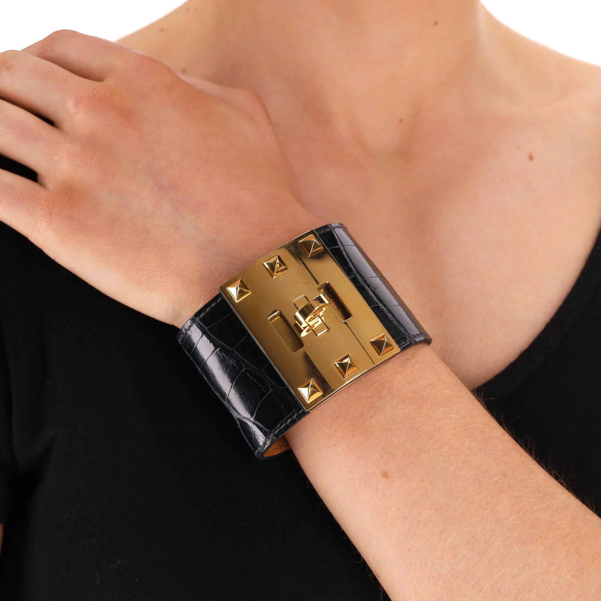 Hermes Alligator Skin Dog Extreme Cuff Bracelet

Shiny Alligator Mississippiensis skin cuff in burgundy red with gold hardware.

The extreme version having pyramid studs.

Date stamp 2015. Rrp Approx. £1,900

Size - S

Condition - Very Good (Light