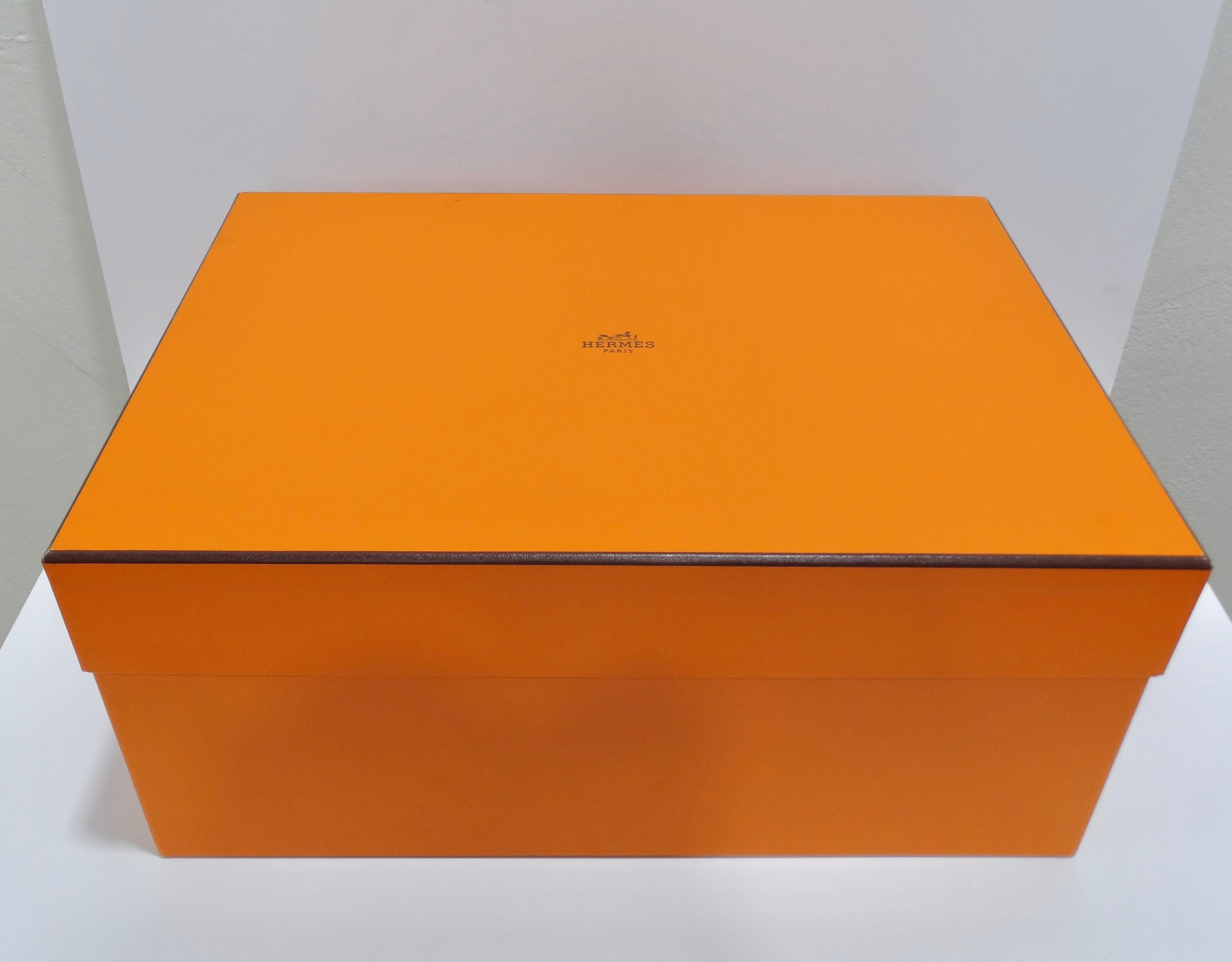 It does not get any more lux than this! This is an expertly made Hermes jewelry and watch box in solid elm with orange velvet lambskin lined interior. The exterior is made of Evercolor calfskin including a stamped detail on the lid. Closure and