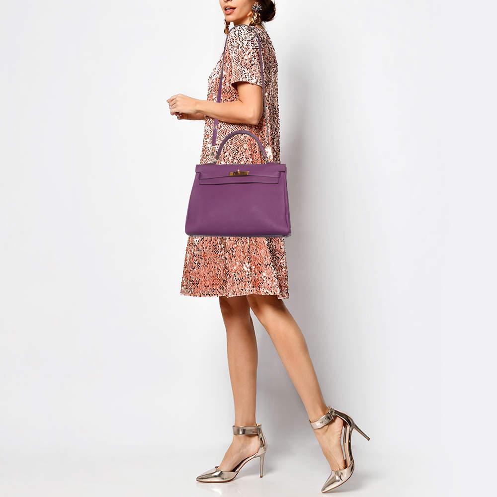 Indulge in timeless luxury with this Hermes Kelly Retourne 32 bag. Meticulously crafted this iconic piece combines heritage elegance and craftsmanship elevating your style to a level of unmatched sophistication.