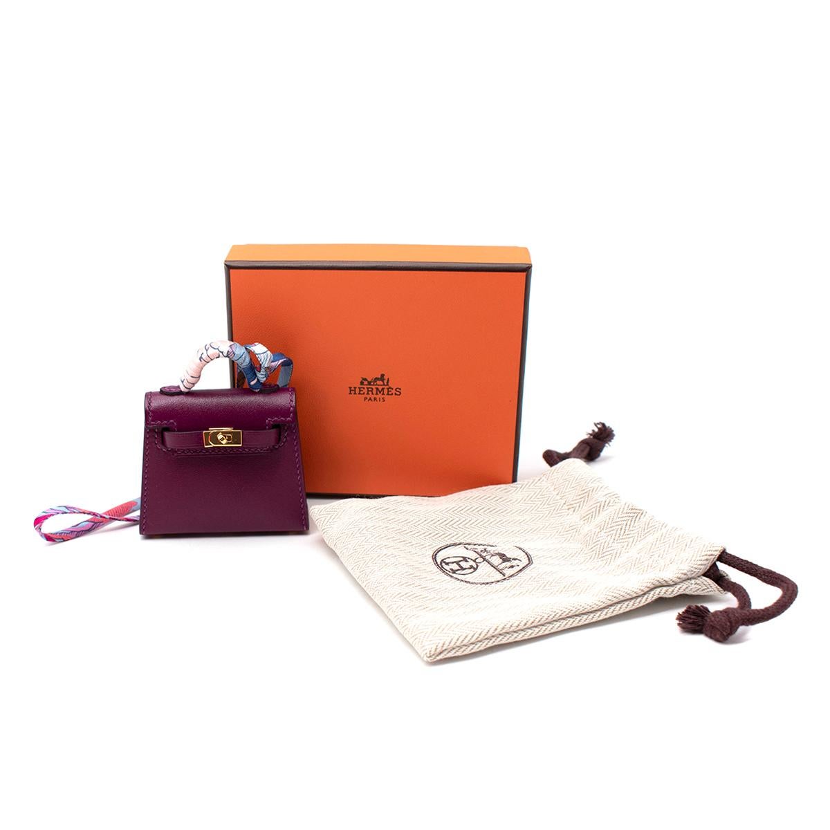 Hermes Anemone Swift/Chevre Leather Micro Kelly Charm

- Age Z - 2021
- Official Colour Anemone
- Gold plated hardware
- silk printed strap wrapped around the rolled top handle
- Fully functioning and opens as a kelly bag would
- Original box and