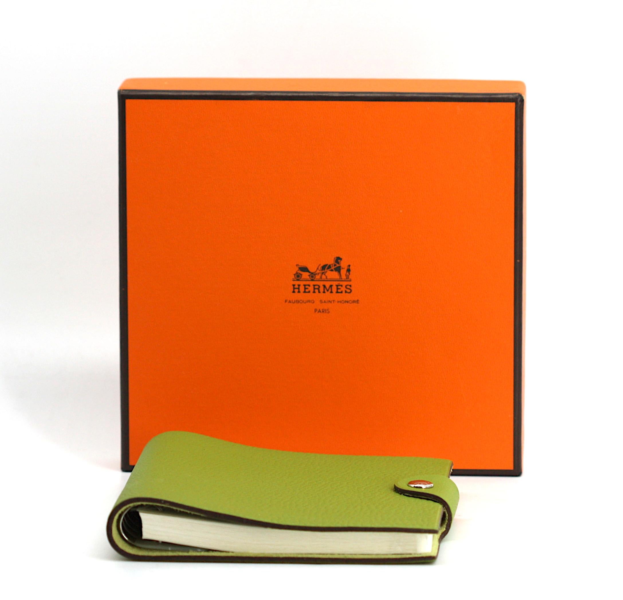 
Hermes Anis/Kiwi Green Togo Leather Notebook Cover, with Spiral inset, 2009.
The back cover with two silver toned gamuts, flap closure, new, with box.
6.25 by 5.25 by 1 in.
Condition Report
Excellent, new.