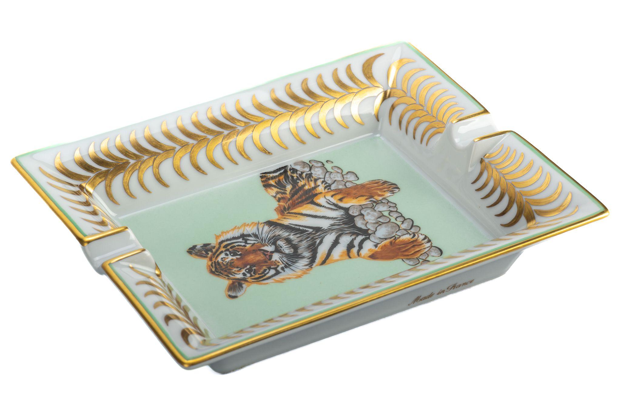 Hermes aqua, white and gold porcelain ashtray with imperial tiger design.