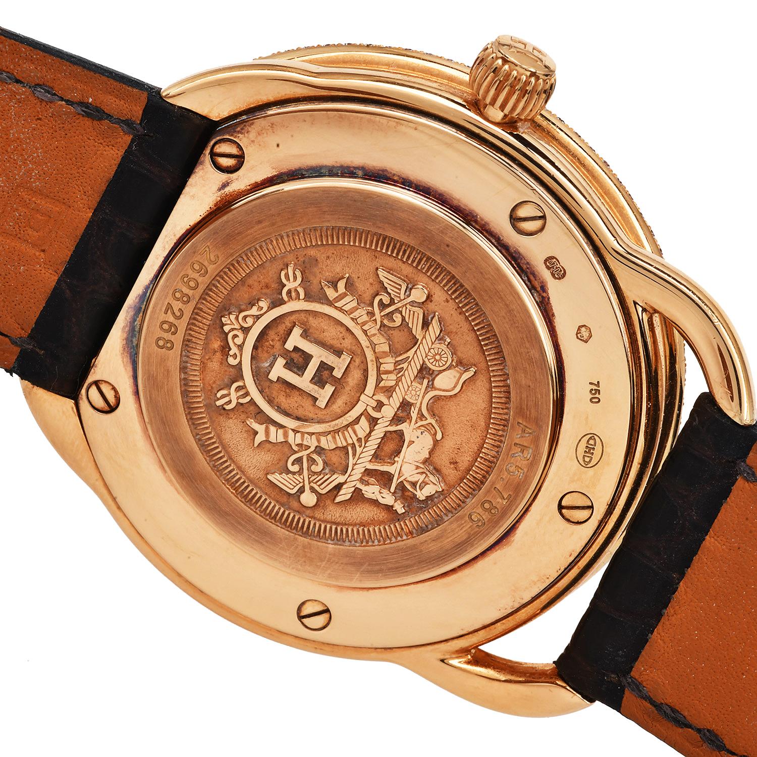 Hermes, Arceau Diamond Yellow Gold  38mm Watch Ref AR5.786. Indulge yourself with this factory diamond dial 18K yellow gold 38mm Hermès watch, Arceau collection with reference number AR5.786  featuring a diamond bezel and quartz movement with a
