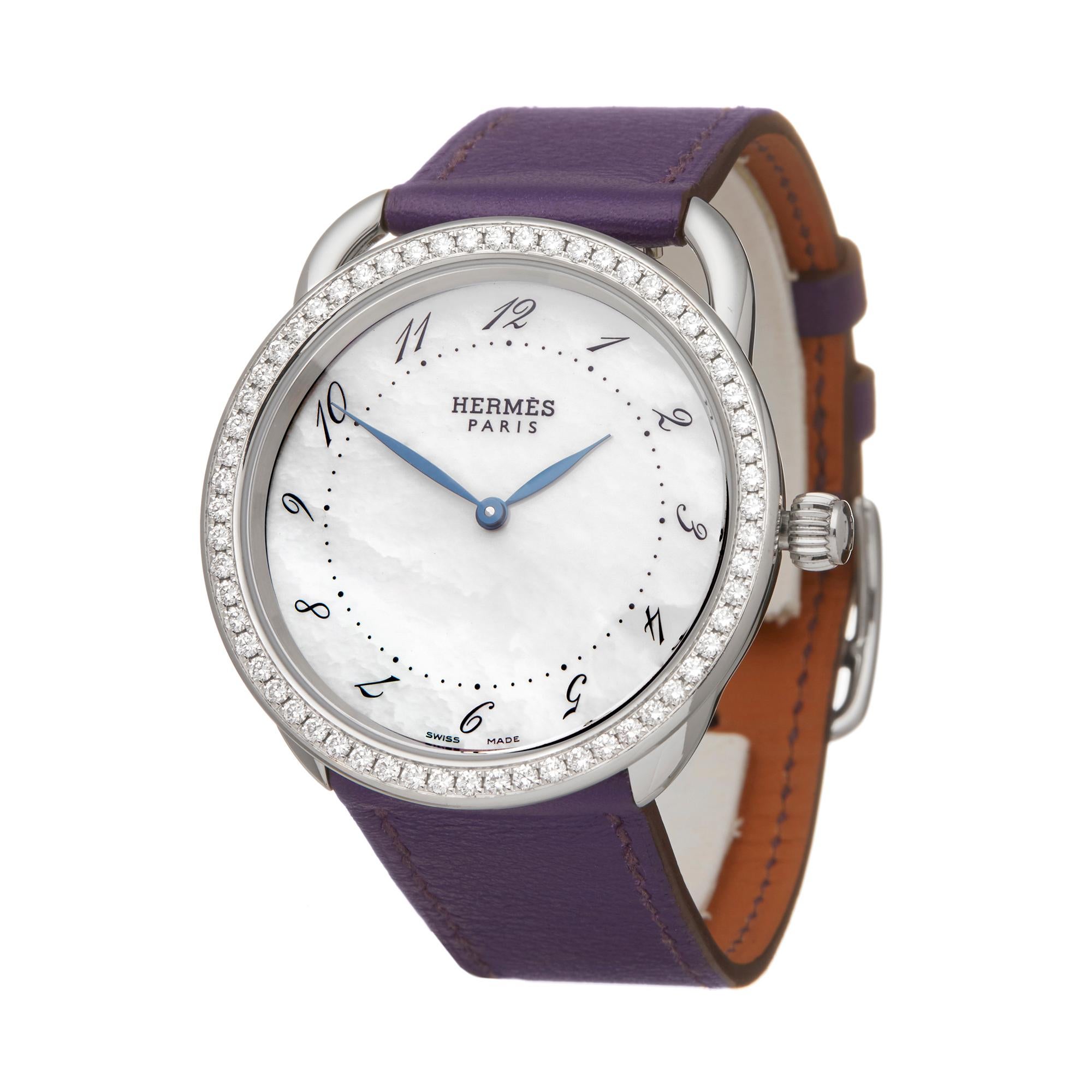 Reference: W6010
Manufacturer: Hermès
Model: Arceau
Model Reference: AR5730
Age: Circa 2010's
Gender: Women's
Box and Papers: Box Only
Dial: Mother Of Pearl Arabic
Glass: Sapphire Crystal
Movement: Quartz
Water Resistance: To Manufacturers