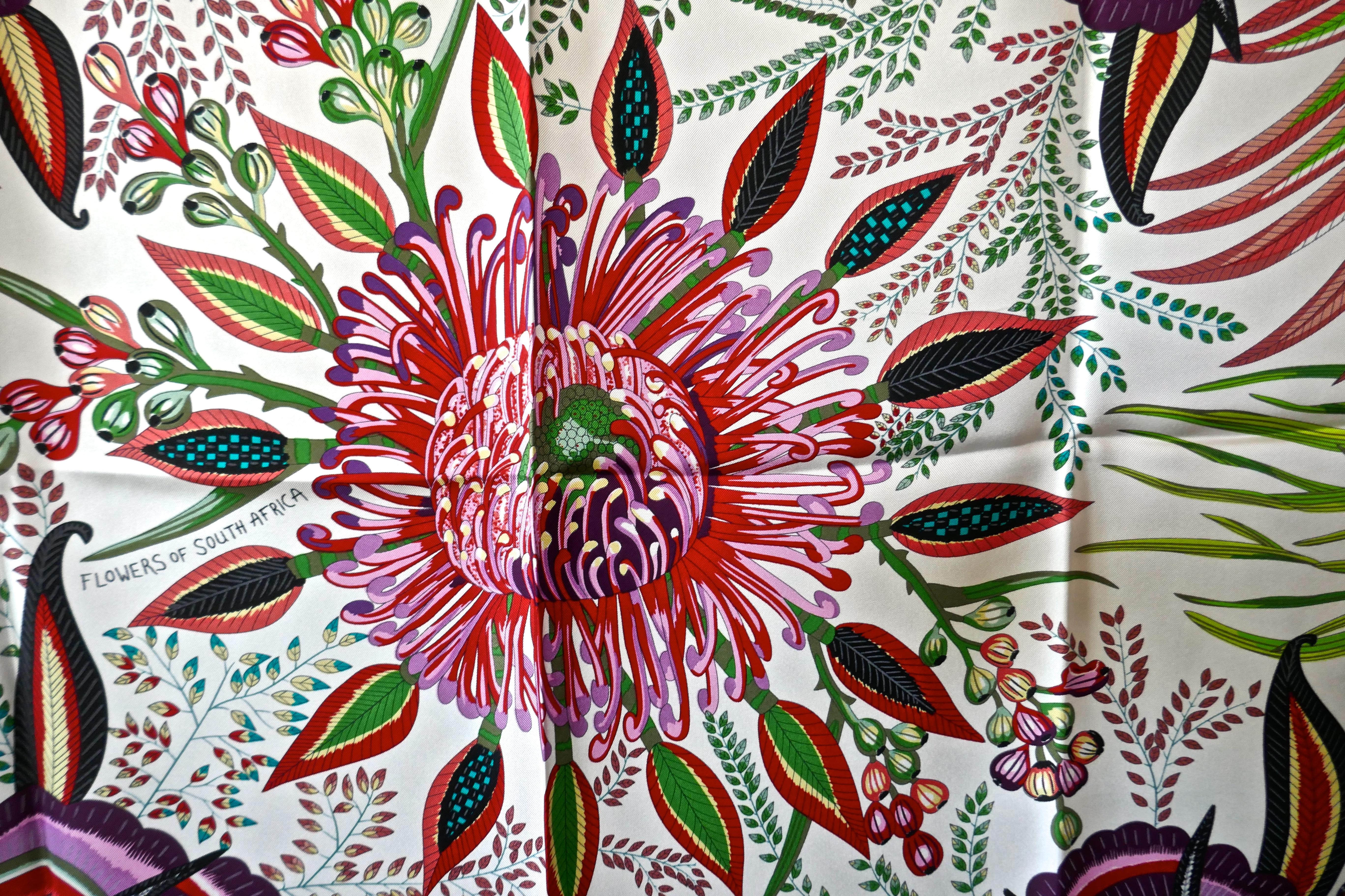 HERMÈS Ardmore Artists design “Flowers of South Africa” 100% Silk Scarf, 2016

 Authenticity Guaranteed made in France by Hermes and in stunning Vibrant Colour palette, offered here unused with all its tags, plump hand rolled edges the Hermes