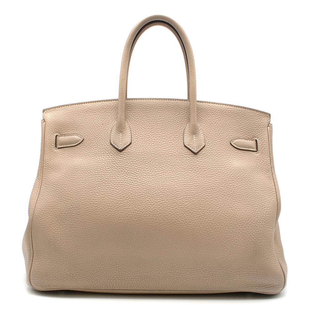 Hermes Argile Taurillion Clemence Leather 35cm Birkin

Age - 2012 [p]
Two rolled top handles,
Signature twist-lock fastening, 
Brown lacquered edges, 
Signature palladium plated hardware, 
Internal zip and slip pocket


Please note, these items are