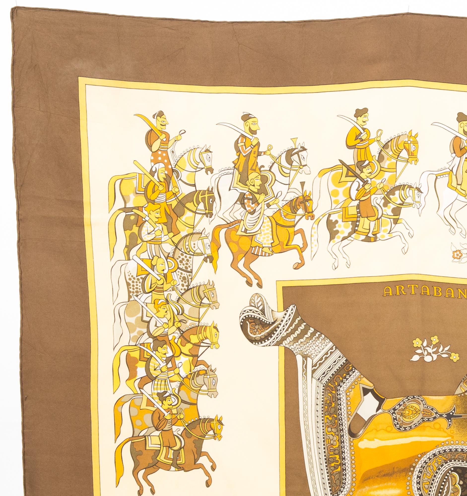 Hermes silk scarf Artaban by Pierre Peron featuring a brown border and a Hermès signature. 
Circa 1980s
In good vintage condition. Made in France.
35,4in. (90cm)  X 35,4in. (90cm)
We guarantee you will receive this  iconic item as described and