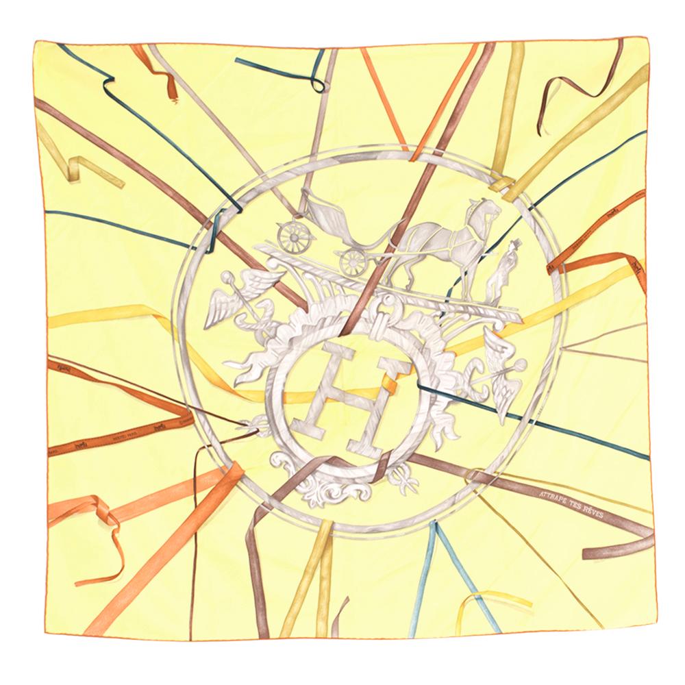 Hermes Silk Scarf Attrape Tes Reves Light Yellow 

- Scarf in silk twill with hand-rolled edges.
- 100% silk.
- First issued in 2008
- Iconic Attrape Tes Reves by Leigh Cooke pays homage to the Hermes logo and famous Hermes bolduc ribbon. 
- Scarf