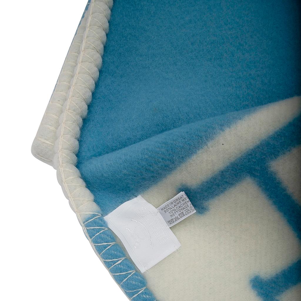 Guaranteed authentic Hermes Avalon Baby blanket features Blue Genievre and Blanc.
Created from 90% Merino Wool and 10% cashmere and has whip stitch edges.
Comes with signature Hermes box.
New or Pristine Store Fresh Condition. 
final sale  

BLANKET