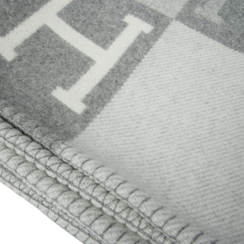 Mightychic offers a guaranteed authentic Hermes classic Avalon III signature H blanket features Gris Clair and Ecru.
Created from 90% Merino Wool and 10% cashmere and has whip stitch edges.
New or Pristine Store Fresh Condition. 
Please see the